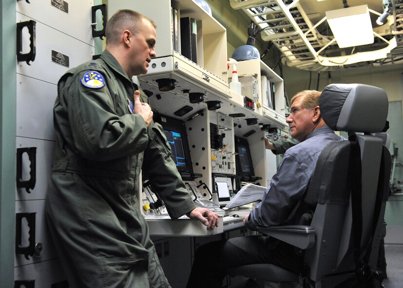 Lt. Col. Todd Sauls, 341st Operations Support Squadron commander, explains alert training and manning procedures to Hon. Terry Yonkers, Assistant Secretary of the Air Force for installations, environment and logistics, during his tour of the missile procedures trainer Nov. 24. Yonkers also made stops to the T-9 trainer, Elkhorn Diner and a missile alert facility during his tour of Malmstrom Nov. 22-24. (U.S. Air Force photo/John Turner)