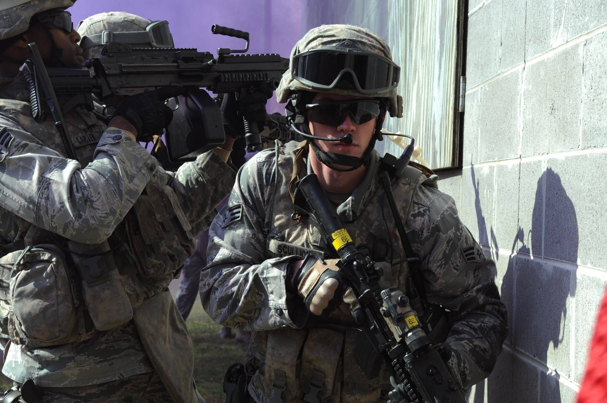 Members of the 820th Base Defense Group demonstrate their skills in a simulated battlefield at Moody Air Force Base, Ga., Nov. 30, 2011. During a visit from U.S. Air Force Maj. Gen. Lawrence Wells, 9th Air Force commander, the 820th BDG gave a preview of how they operate when deployed downrange. (U.S. Air Force photo by Airman 1st Class Olivia Dominique/Released) 