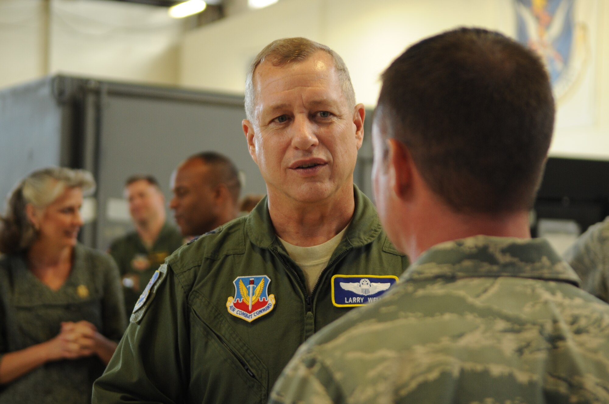 U.S. Air Force Maj. Gen. Lawrence Wells, 9th Air Force commander, speaks to Staff Sgt. Michael Mindziak, 476th Maintenance Squadron crewchief, at Moody Air Force Base, Ga., Nov. 29, 2011. Mindziak was one of many Airmen who were recognized for their hard work and dedication to Moody and the Air Force.  (U.S. Air Force photo by Airman 1st Class Olivia Dominique/Released)
