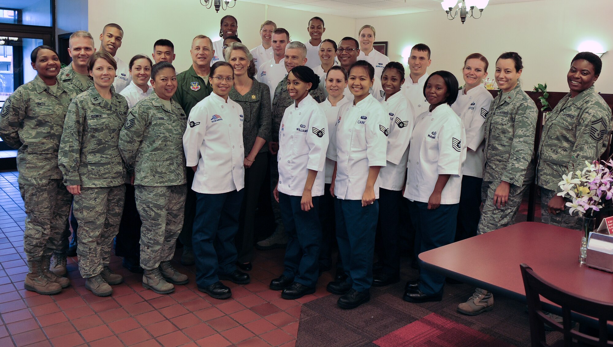 Members of the 23rd Force Support Squadron Georgia Pines Dining Facility gather for a photo at Moody Air Force Base, Ga., Nov. 29, 2011. During a visit from U.S. Air Force Maj. Gen. Lawrence Wells, 9th Air Force commander, the team was announced as winners of the Air Combat Command John L. Hennesy Award. (U.S. Air Force photo by Airman 1st Class Olivia Dominique/Released)