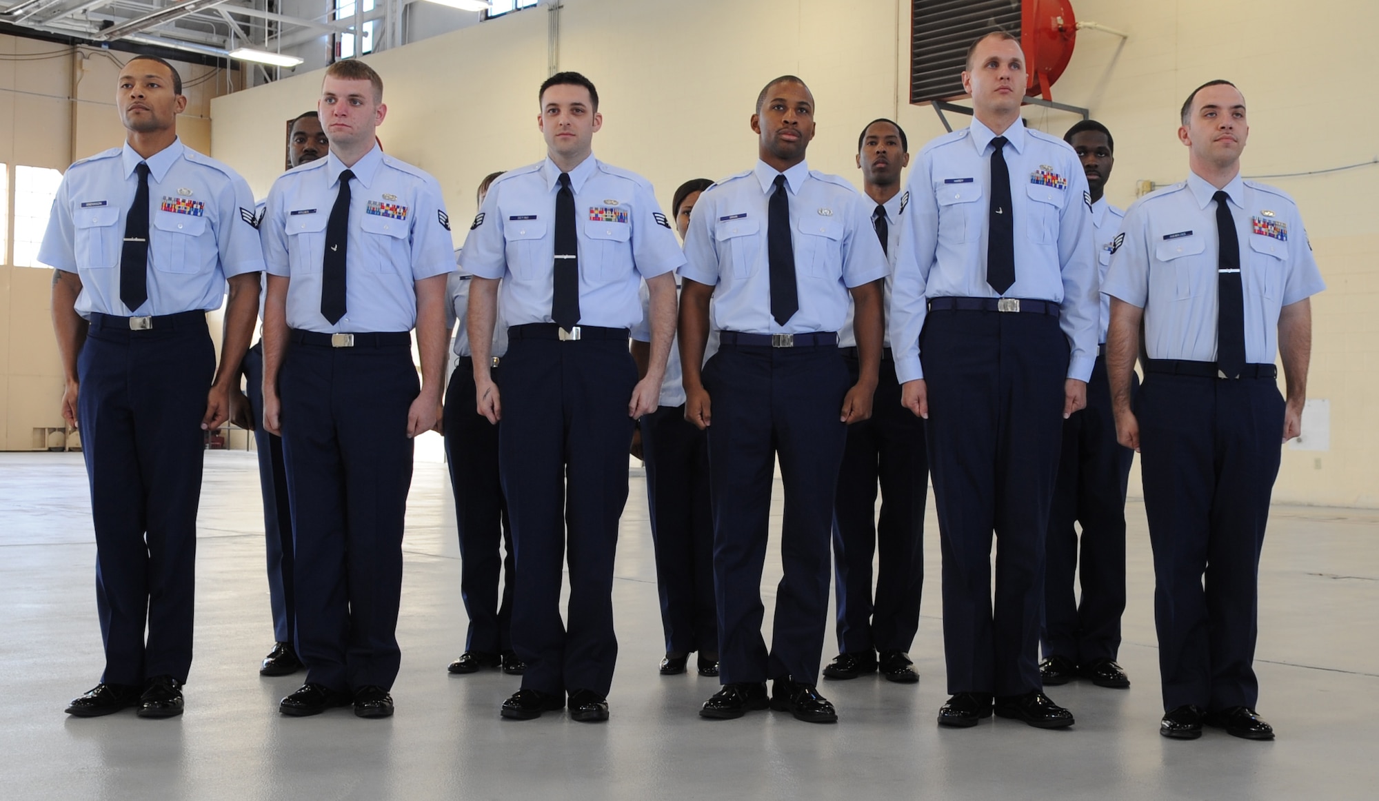 U.S. Air Force senior airmen wait for a promotion ceremony to begin at Moody Air Force Base, Ga., Nov. 30, 2011. The Airmen were acknowledged due to their excellence in their job performance. U.S. Air Force Maj. Gen. Lawrence Wells, who visited Moody for the first time since taking command of 9th Air Force, was in attendance to help congratulate them on the next stages of their careers. (U.S. Air Force photo by Airman 1st Class Olivia Dominique/Released) 