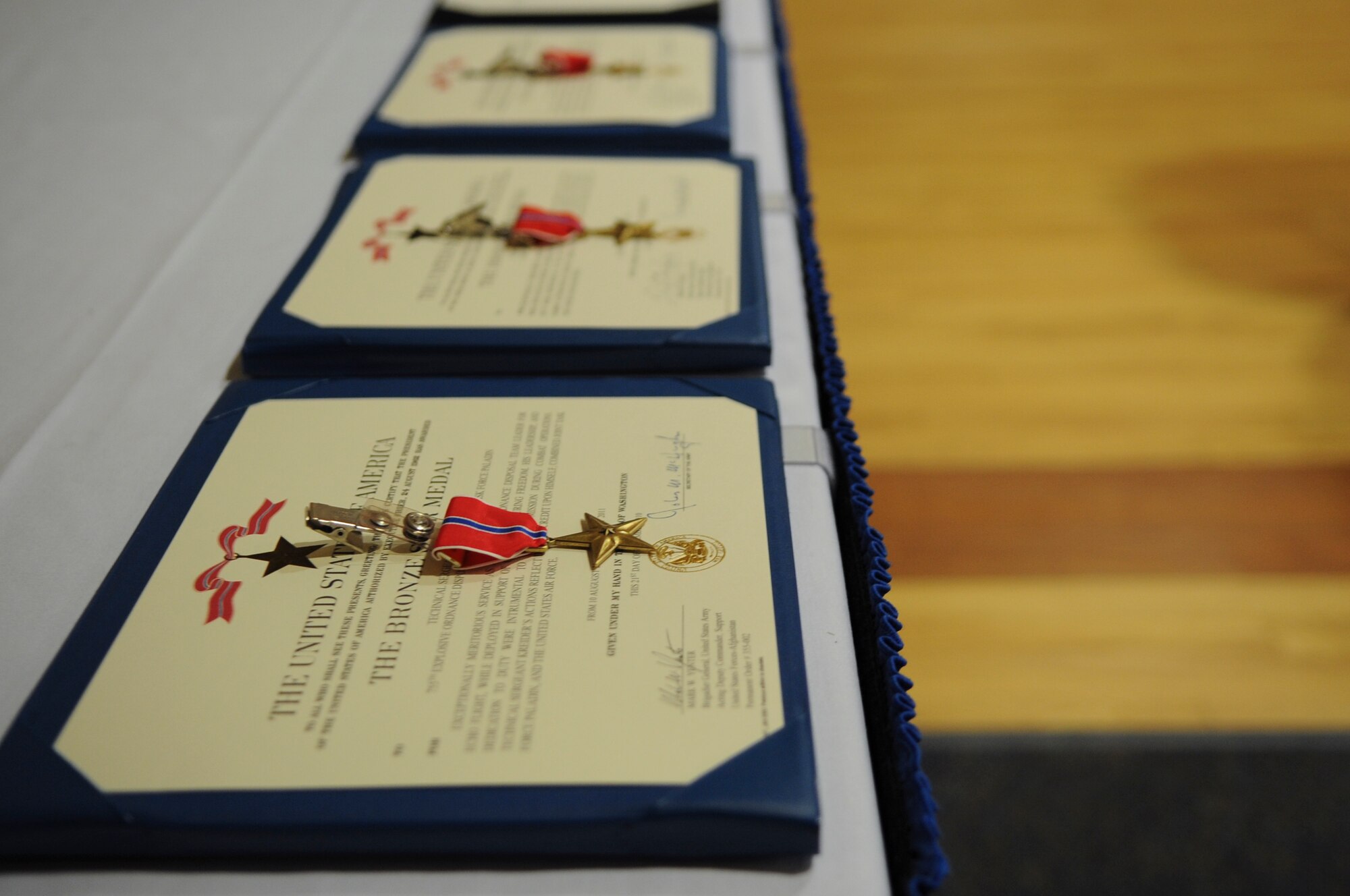 Bronze Star Medals rest before the start of an awards ceremony at Moody Air Force Base, Ga., Nov. 30, 2011. The medals were presented to four Moody Airmen by U.S. Air Force Maj. Gen. Lawrence Wells, 9th Air Force commander. The Bronze Star Medal recognizes acts of heroism performed in ground combat. (U.S. Air Force photo by Airman 1st Class Olivia Dominique/Released)
