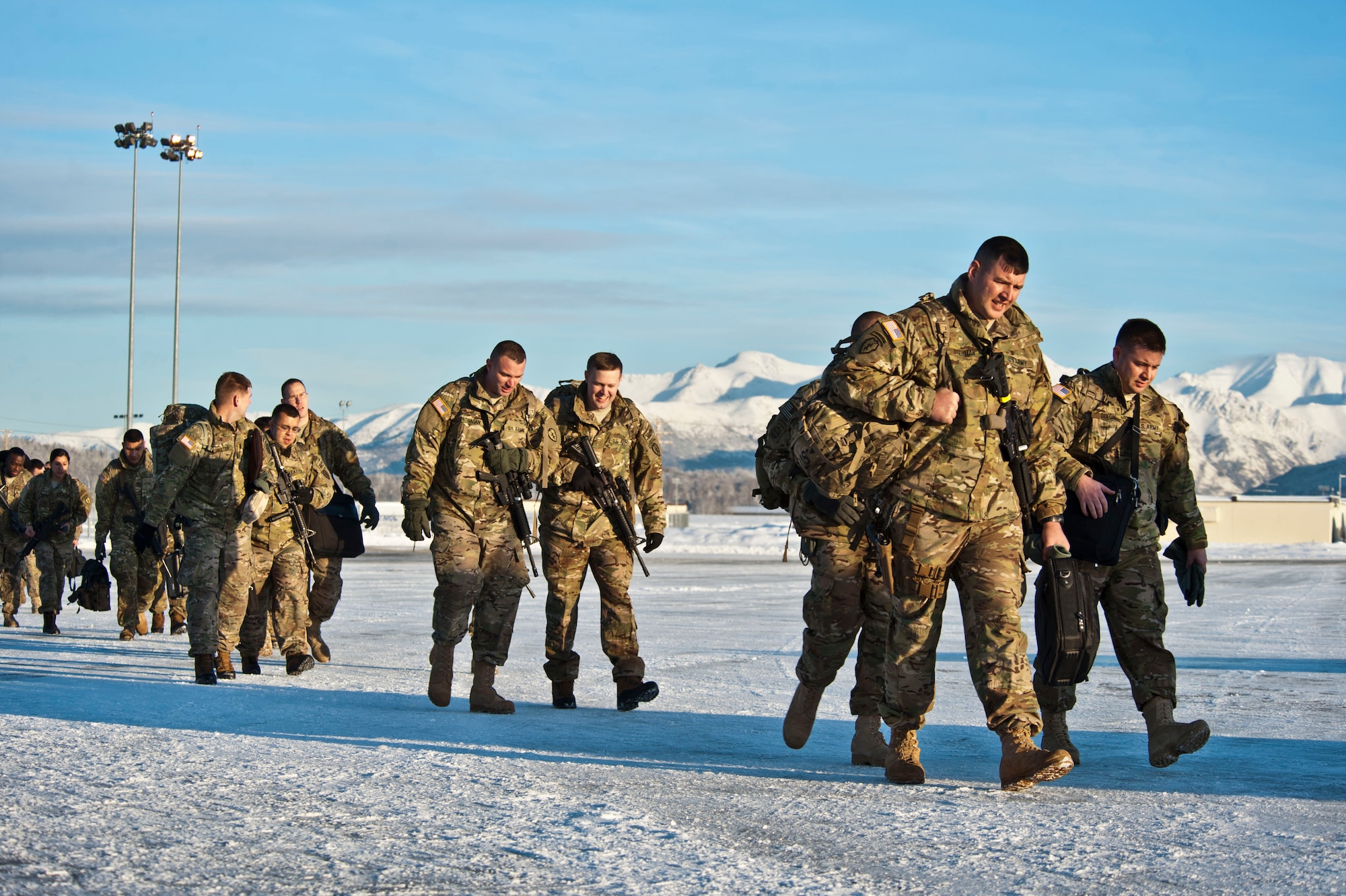 JOINT BASE ELMENDORF-RICHARDSON, Alaska – Soldiers from the 4th Brigade Combat Team (Airborne), 25th Infantry Division make their way to a Boeing 737 as they prepare to leave for a deployment to Afghanistan Nov. 28. The 290 Soldiers who left Nov. 28 made up the first big initial departure. Nov. 28 through mid-December more than 3,500 Soldiers are scheduled to depart Joint Base Elmendorf-Richardson en route to Afghanistan. (U.S. Air Force photo/Senior Airman Christopher Gross)