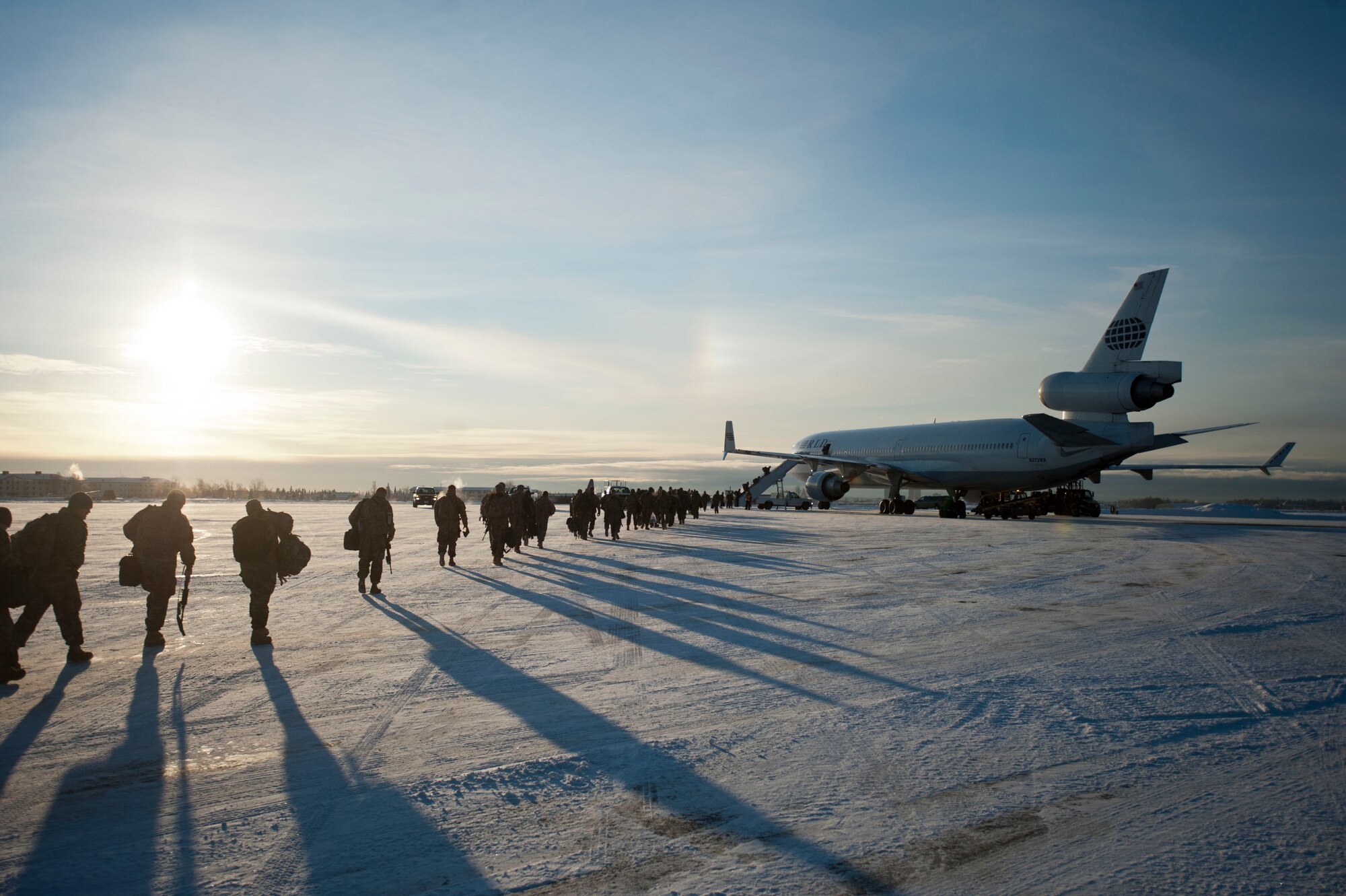 JOINT BASE ELMENDORF-RICHARDSON, Alaska – Soldiers from the 4th Brigade Combat Team (Airborne), 25th Infantry Division make their way to a Boeing 737 as they prepare to leave for a deployment to Afghanistan Nov. 28. The 290 Soldiers who left Nov. 28 made up the first big initial departure. Nov. 28 through mid-December more than 3,500 Soldiers are scheduled to depart Joint Base Elmendorf-Richardson en route to Afghanistan. (U.S. Air Force photo/Senior Airman Christopher Gross)