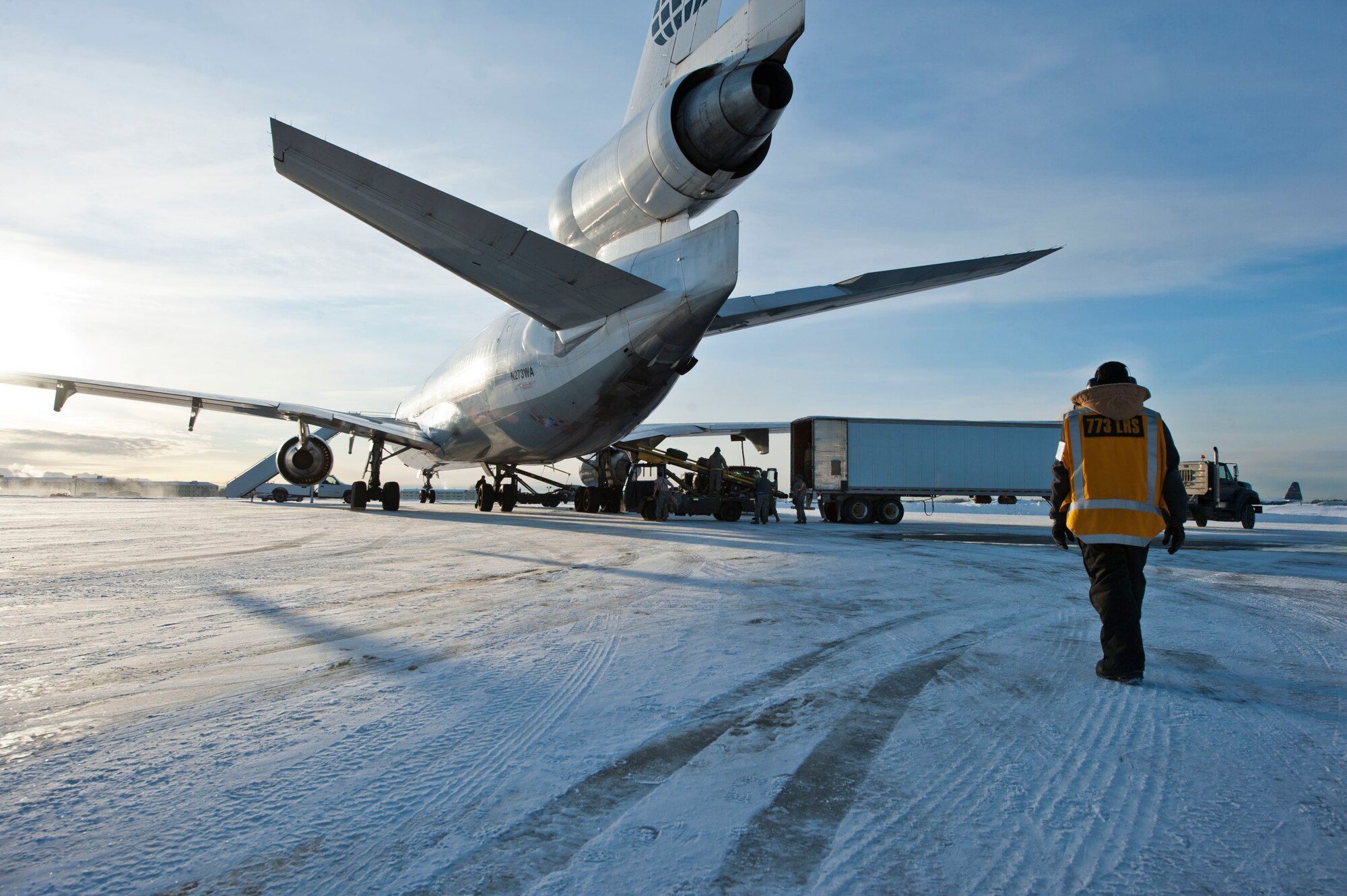 JOINT BASE ELMENDORF-RICHARDSON, Alaska – A member of the 773rd Logistics Readiness Squadron makes his way to a Boeing 737 to help load belongings of Soldiers from the 4th Brigade Combat Team (Airborne), 25th Infantry Division Nov. 28. Two hundred and ninety Soldiers left Joint Base Elmendorf-Richardson Nov. 28 en route to Afghanistan. They made up the first big initial departure. Nov. 28 through mid-December more than 3,500 Soldiers are scheduled to JBER en route to Afghanistan. (U.S. Air Force photo/Senior Airman Christopher Gross)
