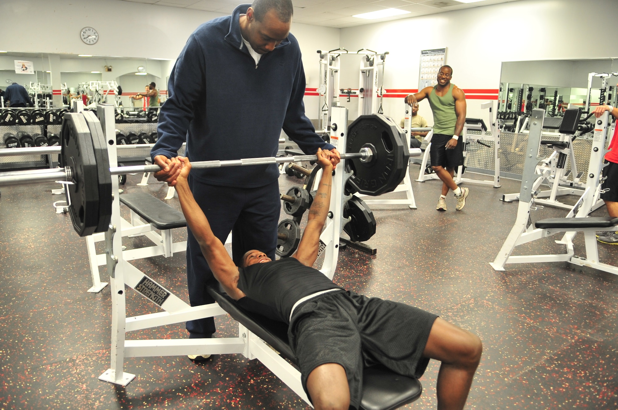 Airman 1st Class Marcus Toney lifts 235 pounds at the base gym on Seymour Johnson Air Force Base, N.C., Nov. 8, 2011. Toney, who weighs considerably less than the weight he is lifting, is training to apply for the Air Force Track Team, where active-duty Airmen are released from their current career field to compete with the team for a season. Toney, an operations manager with the 4th Civil Engineer Squadron, aspires to enter the world class athletes program, which trains servicemembers to compete in the Olympics. (U.S. Air Force photo by Senior Airman Marissa Tucker) 