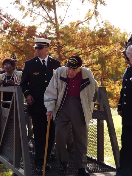A World War II veteran makes his way to the Veteran's Day program Nov. 11 at the Veteran's Memorial Park in Shreveport. The event provided veterans the opportunity to tell stories and reminisce about their past experiences. (U.S. Air Force photo/Staff Sgt. Christina Dickerson)(RELEASED)