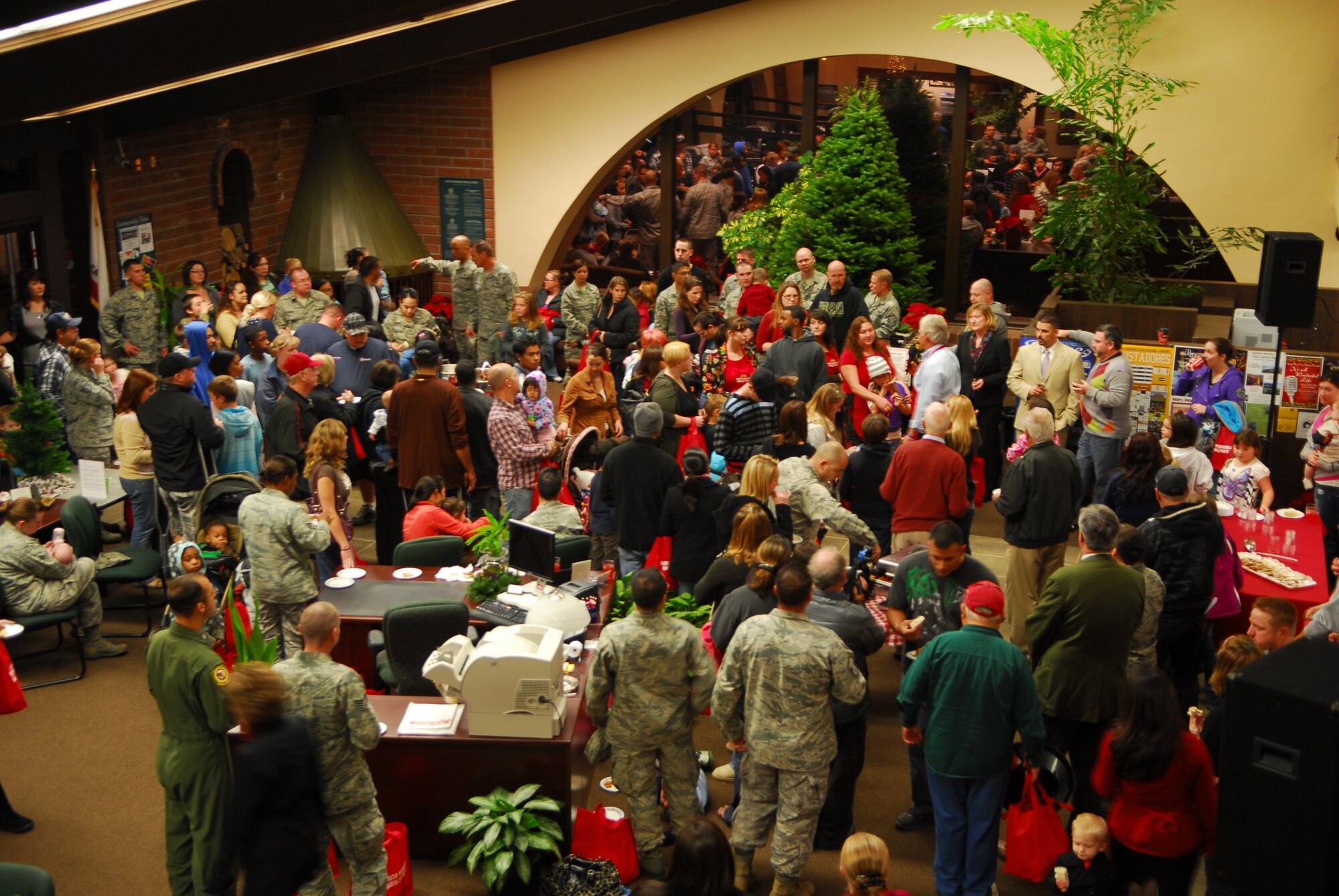VANDENBERG AIR FORCE BASE, Calif. – A crowd gathers at the Santa Barbara Bank and Trust in Lompoc during a ceremony in which holiday trees were donated to Vandenberg Airmen Wednesday, Nov. 30, 2011. (U.S. Air Force photo/Senior Airman Steve Bauer)