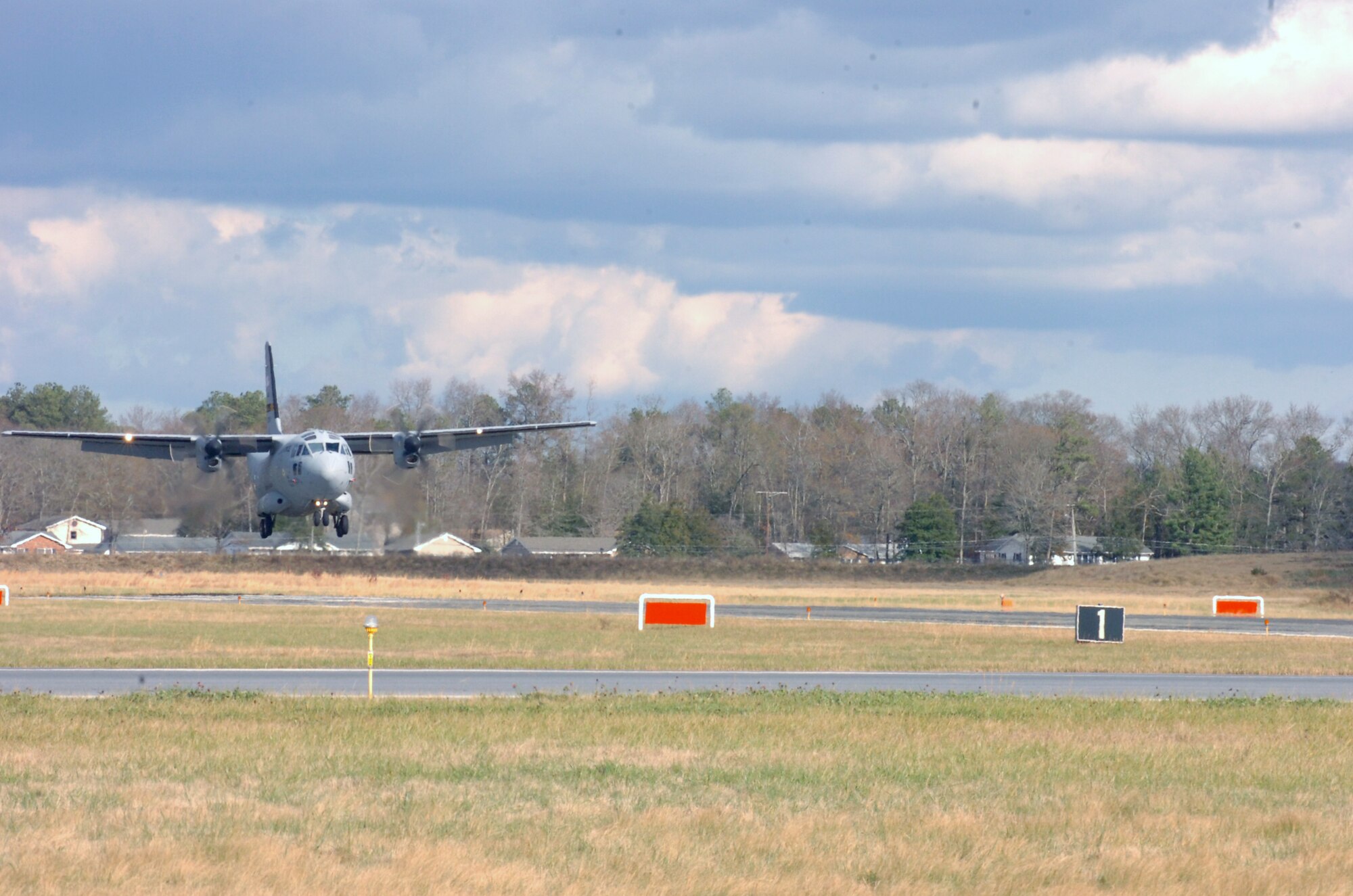 The C-27J comes in for a landing using the assault zone marking panels funded and implemented by the Wicomico Regional Airport. (National Guard Photo by 2nd Lt. Jessica Donnelly/RELEASED)