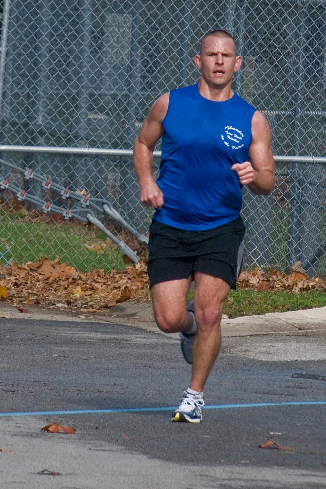 GRISSOM AIR RESERVE BASE, Ind. -- Bob Atkins rounds the corner headed straight for the finish line during a 5-kilometer 'turkey trot' Nov. 15. Atkins finished the race with the fastest time. The runners predicted their finish time prior to the race, and those who completed closest to their time bagged a turkey for the holidays. It was Paul Weimer, Robert Sucharski and Chris Feltis who took home a bird.  (U.S. Air Force photo/ Senior Airman Jami K. lancette)