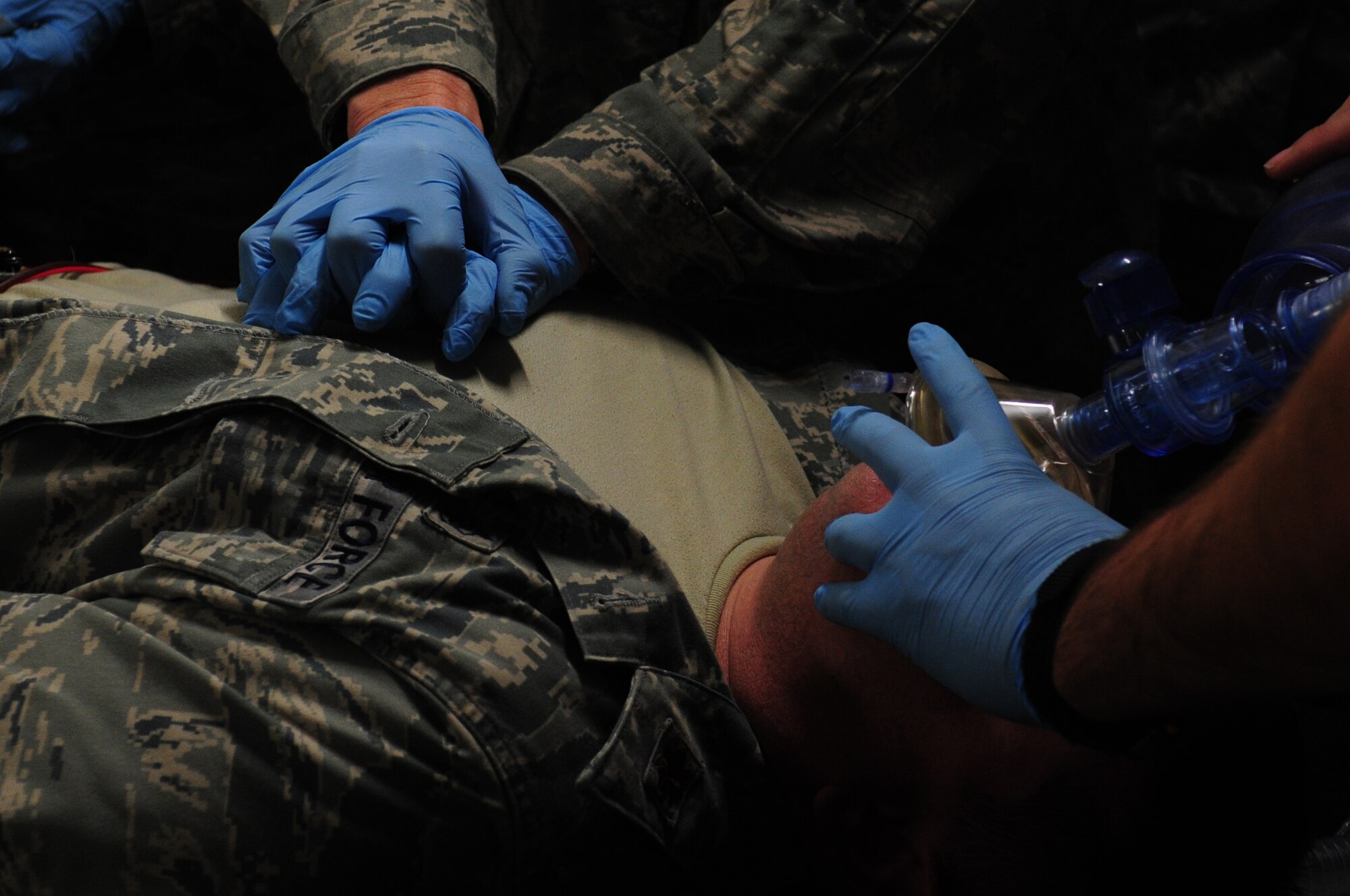 Medics try to resuscitate an Airman during an expeditionary Medical Support Exercise, Ramstein Air Base, Dec. 01, 2011. EMEDS was a week-long exercise for the 86th and 31st Medical Group to hone their skills in a mock-deployed environment. (U.S. Air Force photo by Senior Airman Aaron-Forrest Wainwright)