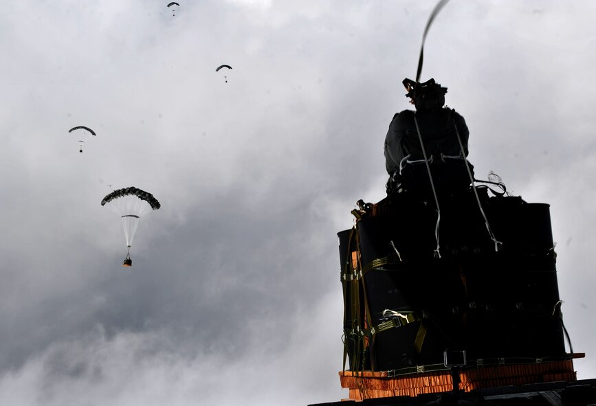 A parachute bundle with an  Joint Precision Air Drop System is dropped from a C-130J Hercules Nov. 27, 2011, to a remote forward operating base. The JPAD system uses a GPS navigation system to guide parachute bundles to precise drop zones, minimizing collateral damage, troops' ground travel and the vulnerability of the aircraft.  (U.S. Air Force photo/Senior Airman Tyler Placie)