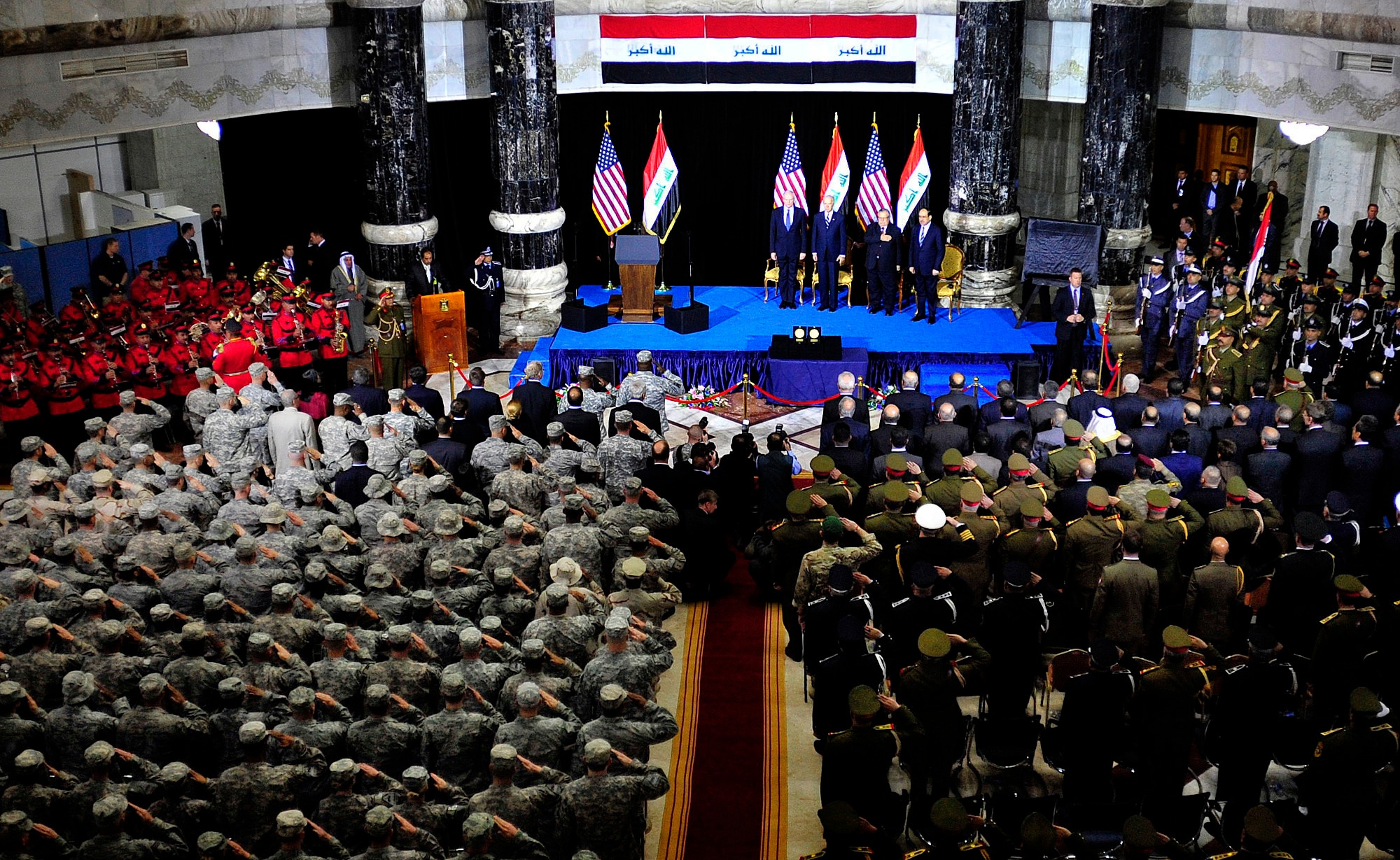James F. Jeffrey, ambassador to Iraq (left) U.S. Vice President, Joe Biden, Iraqi President Jalal Talabani, Iraqi Prime Minister, Nouri al-Maliki along with U.S and Iraqi service members stand and salute during the singing of the Iraqi and U.S. national anthems during the Government of Iraq Day of Commitment Ceremony in the Al Faw Palace at Victory Base Complex, Iraq, Dec. 1, 2011. The ceremony commemorated the sacrifices and accomplishments of U.S. and Iraqi service members. (U.S. Air Force photo/Master Sgt. Cecilio Ricardo)