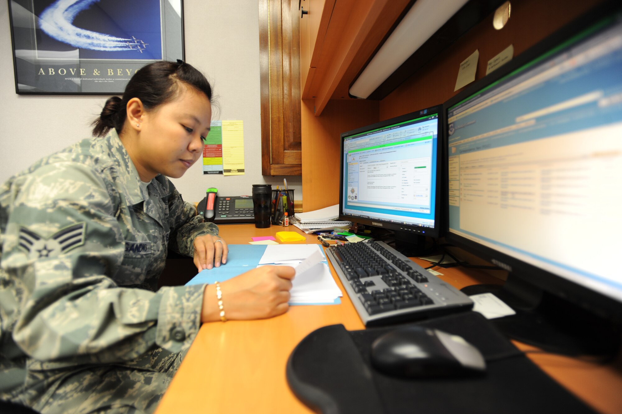Senior Airman Cholrak DelGandio, 22nd Mission Support Group knowledge operations manager, prepares a coordination package Nov. 29, 2011, McConnell Air Force Base, Kan. DelGandio is responsible for handling coordination packages and records management for the 22nd MSG. (U.S. Air Force photo/ Airman 1st Class Jose L. Leon)