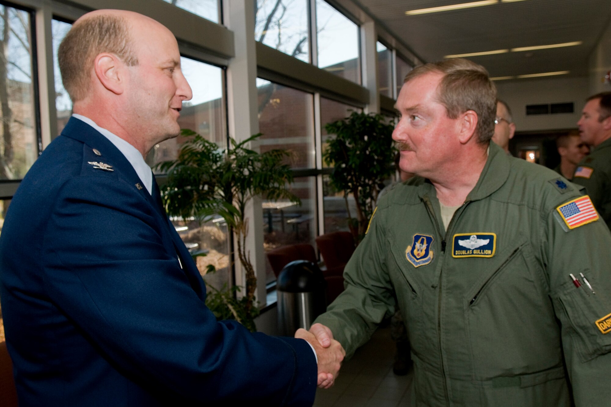 GRISSOM AIR RESERVE BASE, Ind. -- Lt. Col. Douglas Gullion, right, welcomes Col. Christopher Amend to Grissom shortly after Amend's assumption of command ceremony here Nov. 6. Amend took command of the 434th Operations Group, the largest KC-135R Stratotanker OG in the Air Force Reserve Command. Gullion is the 72nd Air Refueling Squadron operations officer. The 434th OG consists of the 72nd ARS, 74th ARS and the 434th Operations Support Squadron. (U.S. Air Force photo/Tech. Sgt. Mark R. W. Orders-Woempner)
