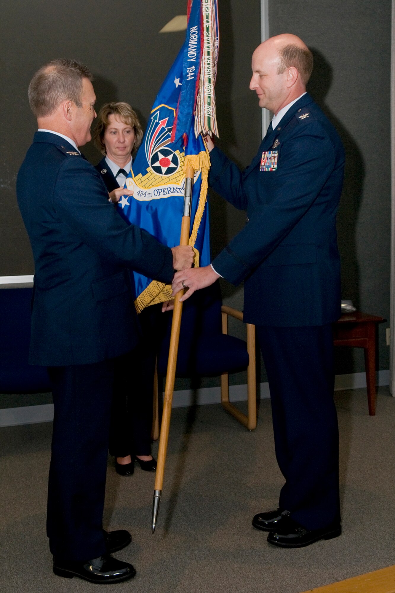 GRISSOM AIR RESERVE BASE, Ind. -- Col. William T. "Tim" Cahoon presents Col. Christopher Amend with the 434th Operations Group guidon during Amends assumption of command ceremony held here in Gus Grissom Hall Nov. 6. During the ceremony, Amend took command of the 434th Operations Group, the largest KC-135R Stratotanker OG in the Air Force Reserve Command. Cahoon is the 434th Air Refueling Wing commander. (U.S. Air Force photo/Tech. Sgt. Mark R. W. Orders-Woempner)
