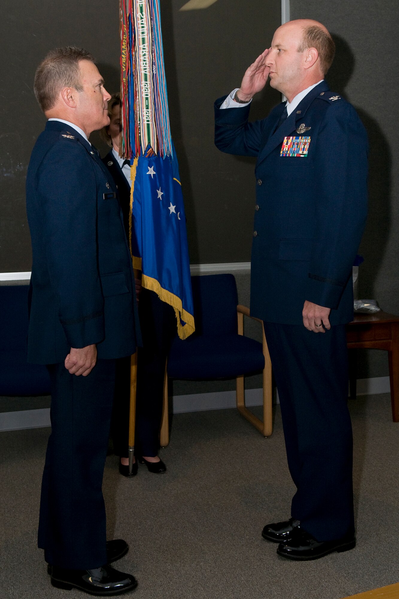 GRISSOM AIR RESERVE BASE, Ind. -- Col. Christopher Amend, right,  salutes Col. William T. "Tim" Cahoon as he takes command of the 434th Operations Group during a special ceremony held here in Gus Grissom Hall Nov. 6. Cahoon is the 434th Air Refueling Wing commander. (U.S. Air Force photo/Tech. Sgt. Mark R. W. Orders-Woempner)
