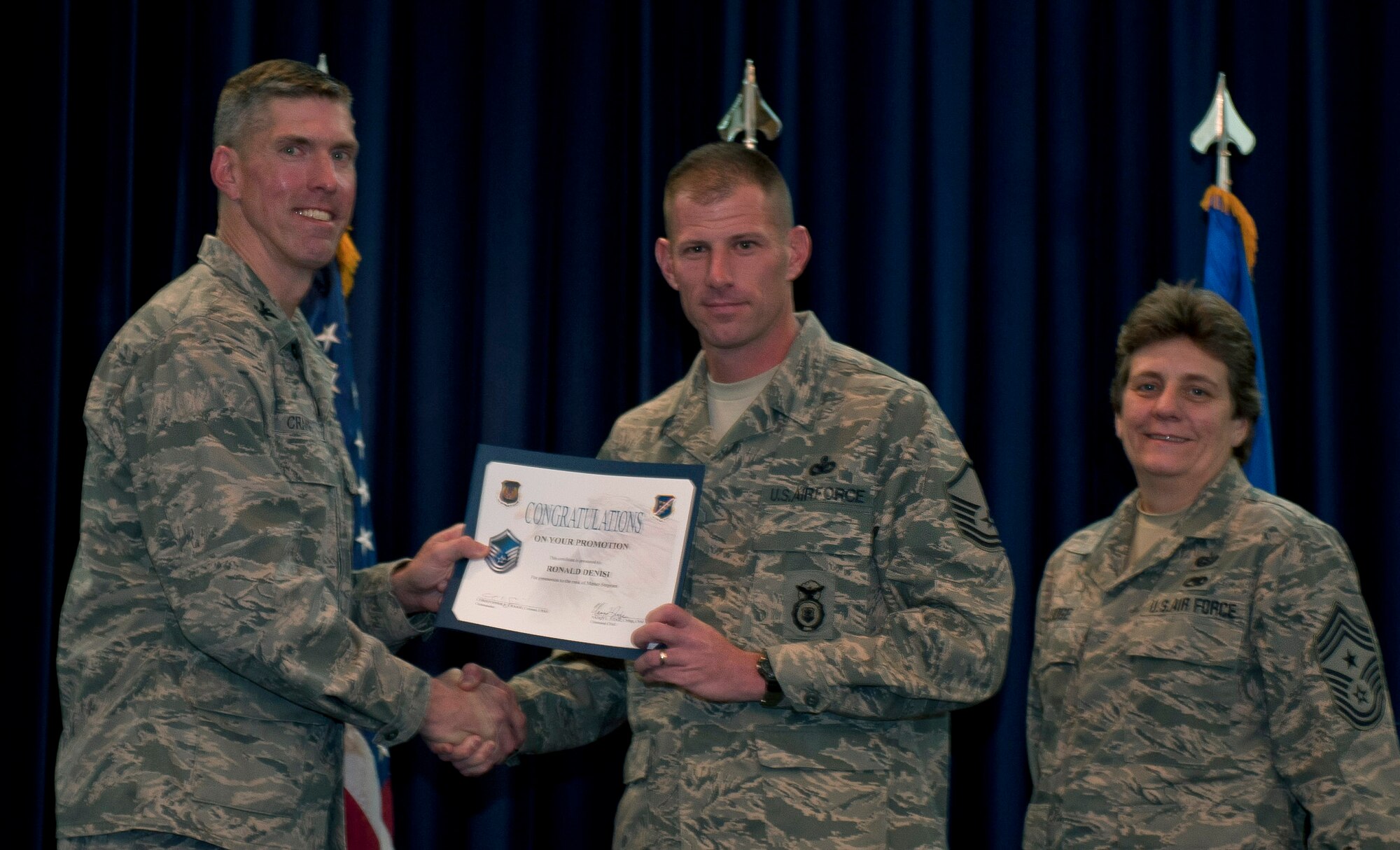 Ronald Denisi, 39th Security Forces Squadron, is promoted to the rank of master sergeant Nov. 30, 2011, in the Club Complex ballroom at Incirlik Air Base, Turkey. (U.S. Air Force photo by Senior Airman Anthony Sanchelli/Released)