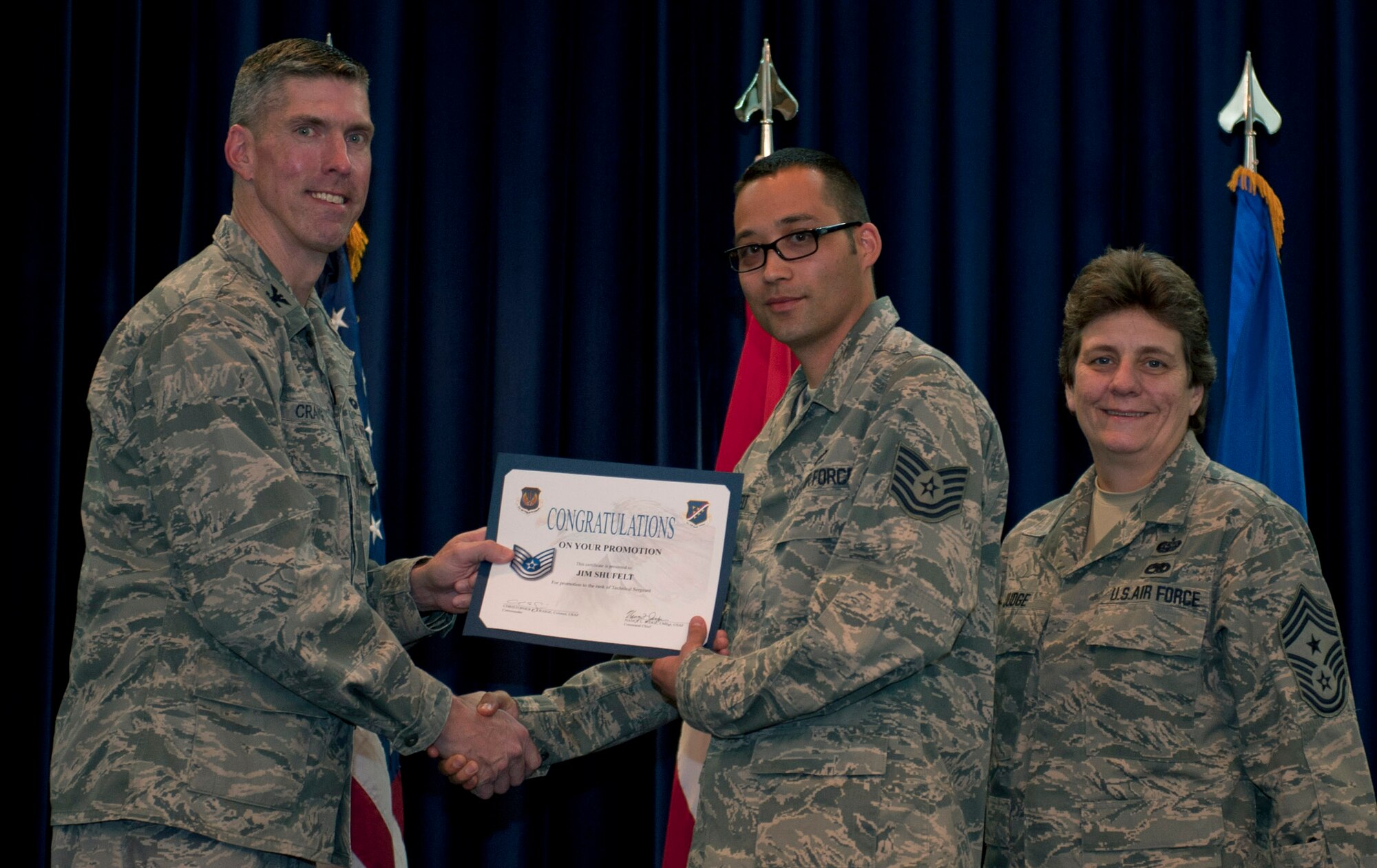 Jim Shufelt, 414th Expeditionary Reconnaissance Squadron, is promoted to the rank of technical sergeant Nov. 30, 2011, in the Club Complex ballroom at Incirlik Air Base, Turkey. (U.S. Air Force photo by Senior Airman Anthony Sanchelli/Released)