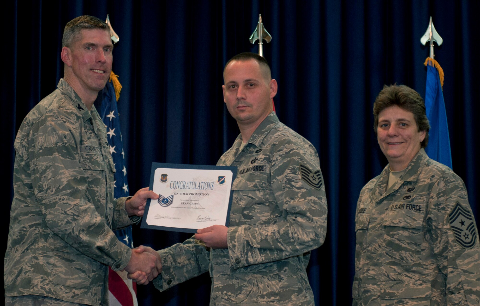 Sean Cripe, 39th Operations Squadron, is promoted to the rank of technical sergeant Nov. 30, 2011, in the Club Complex ballroom at Incirlik Air Base, Turkey. (U.S. Air Force photo by Senior Airman Anthony Sanchelli/Released)