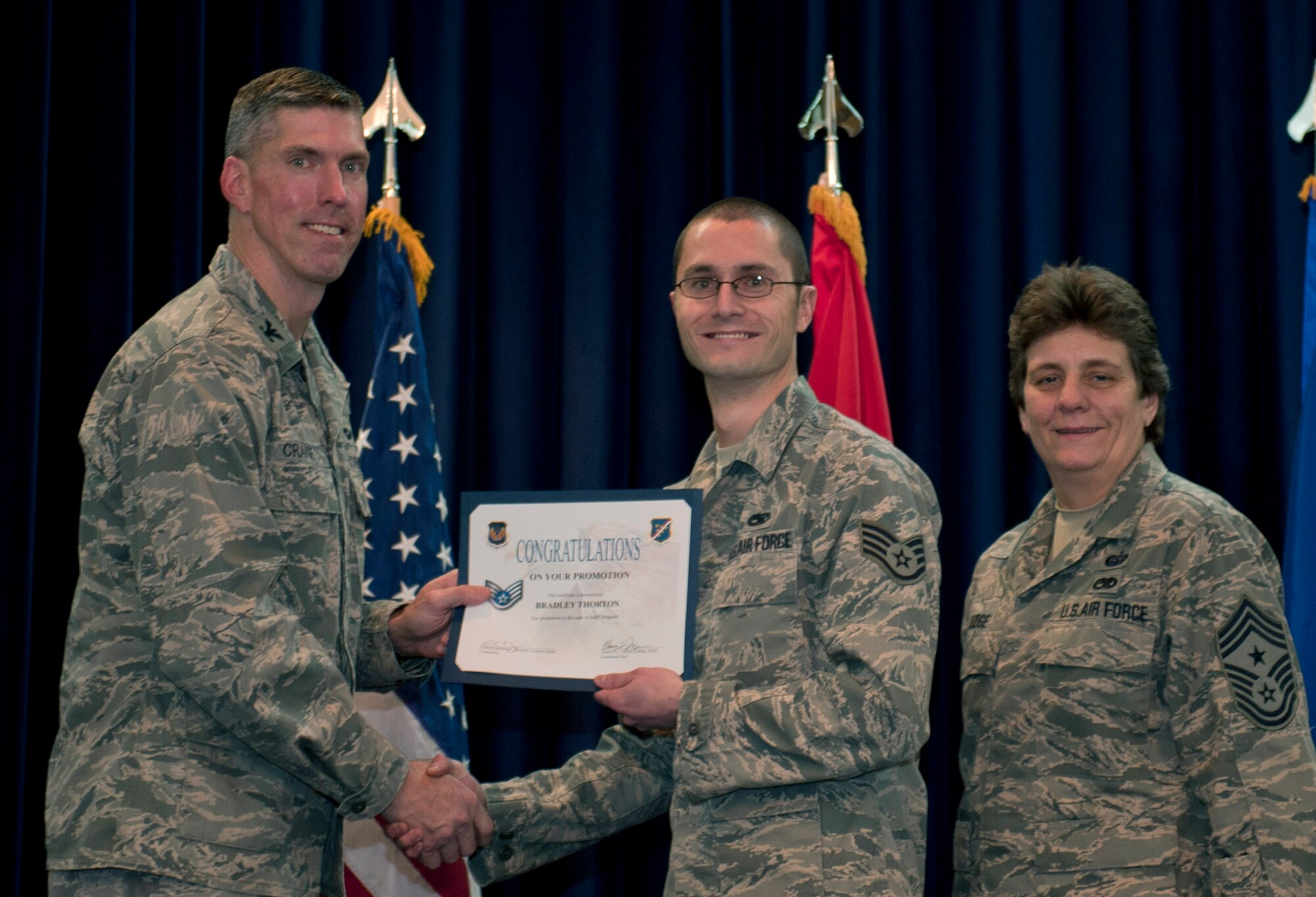 Bradley Thornton, 728th Air Mobility Squadron, is promoted to the rank of staff sergeant Nov. 30, 2011, in the Club Complex ballroom at Incirlik Air Base, Turkey. (U.S. Air Force photo by Senior Airman Anthony Sanchelli/Released)