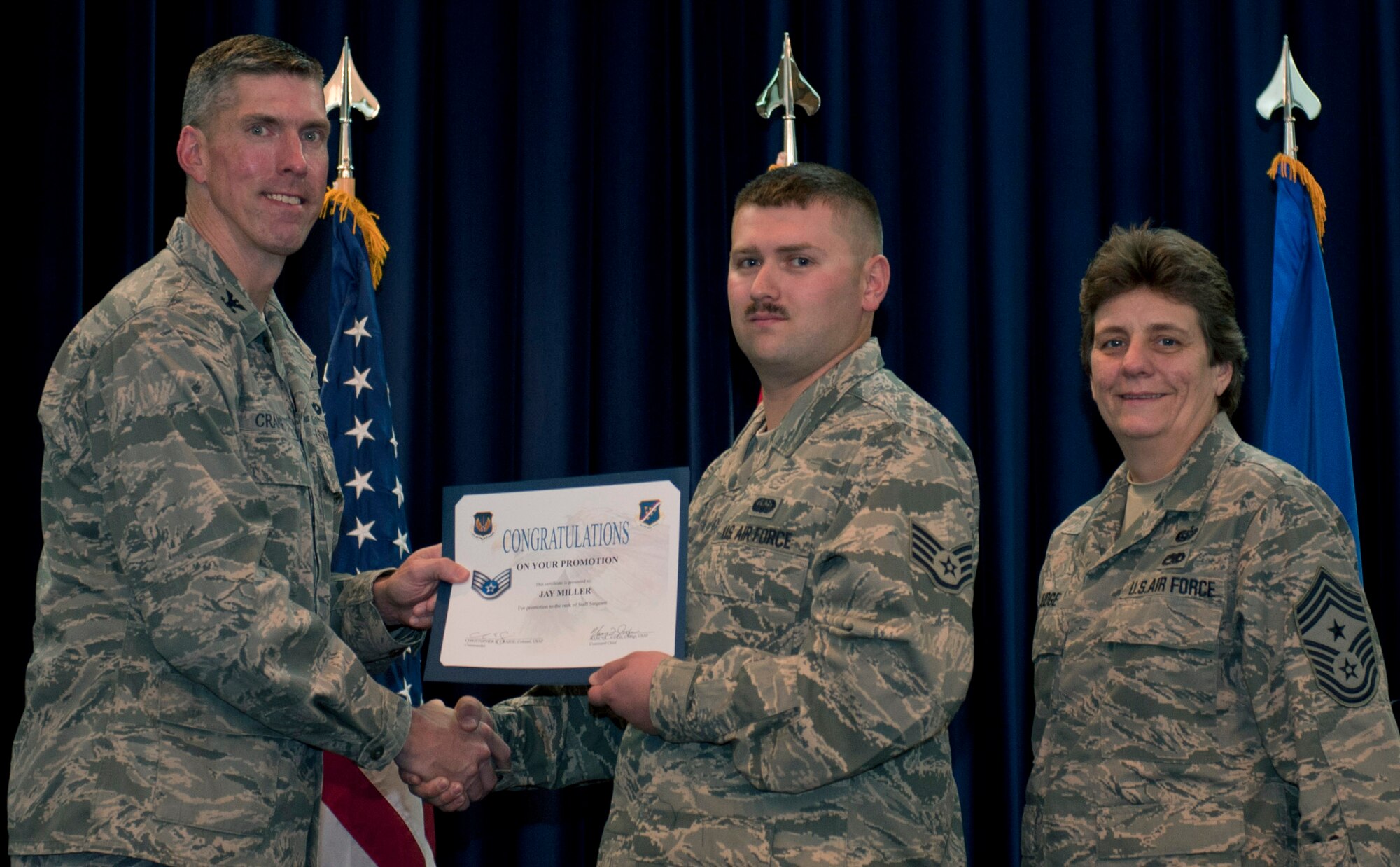 Jay Miller, 728th Air Mobility Squadron, is promoted to the rank of staff sergeant Nov. 30, 2011, in the Club Complex ballroom at Incirlik Air Base, Turkey. (U.S. Air Force photo by Senior Airman Anthony Sanchelli/Released)