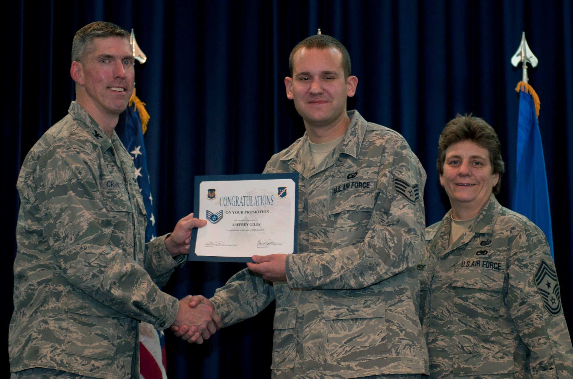 Jeffrey Giles, 39th Operations Squadron, is promoted to the rank of staff sergeant Nov. 30, 2011, in the Club Complex ballroom at Incirlik Air Base, Turkey. (U.S. Air Force photo by Senior Airman Anthony Sanchelli/Released)