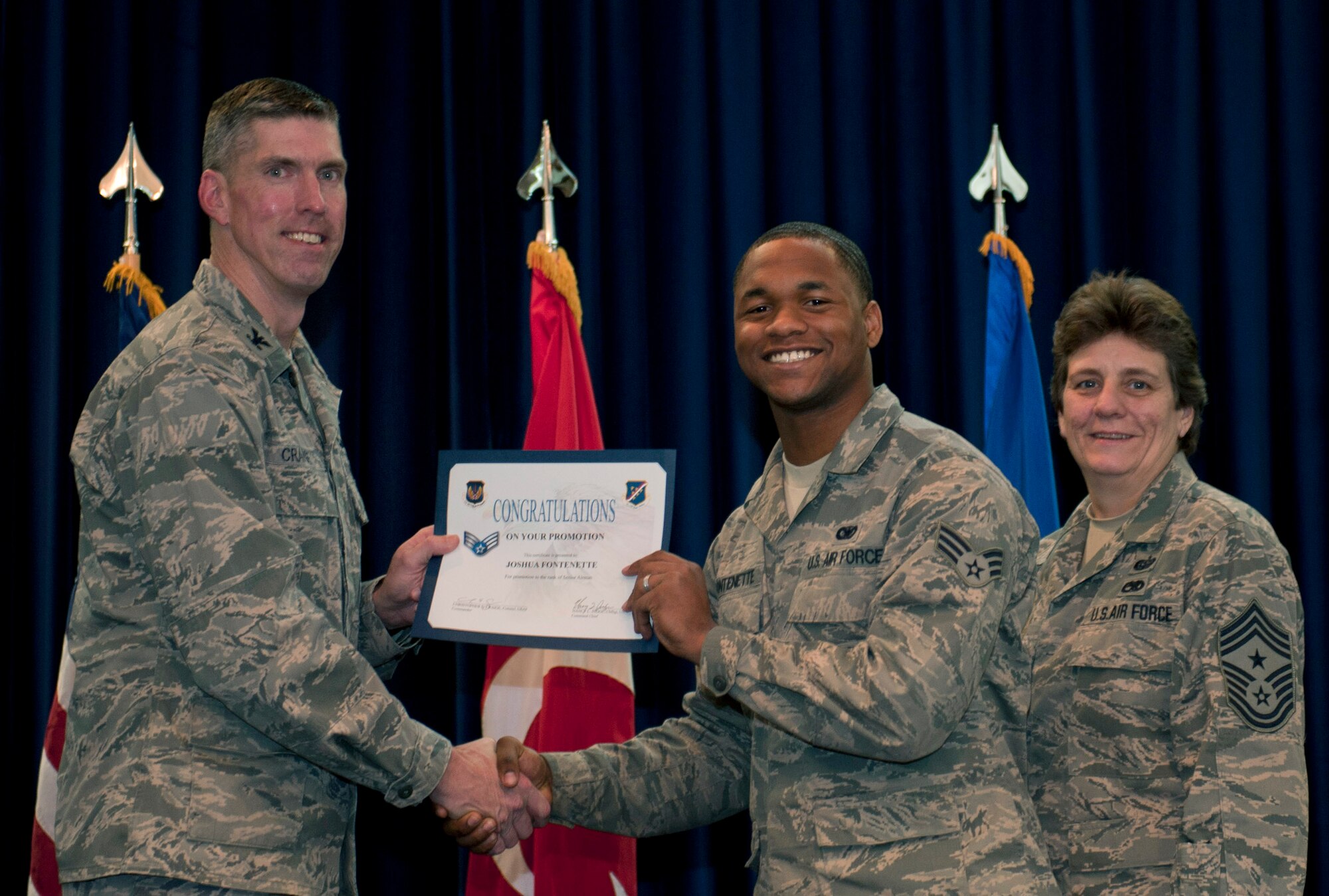 Joshua Fontenette, 39th Security Forces Squadron, is promoted to the rank of senior airman Nov. 30, 2011, in the Club Complex ballroom at Incirlik Air Base, Turkey. (U.S. Air Force photo by Senior Airman Anthony Sanchelli/Released)