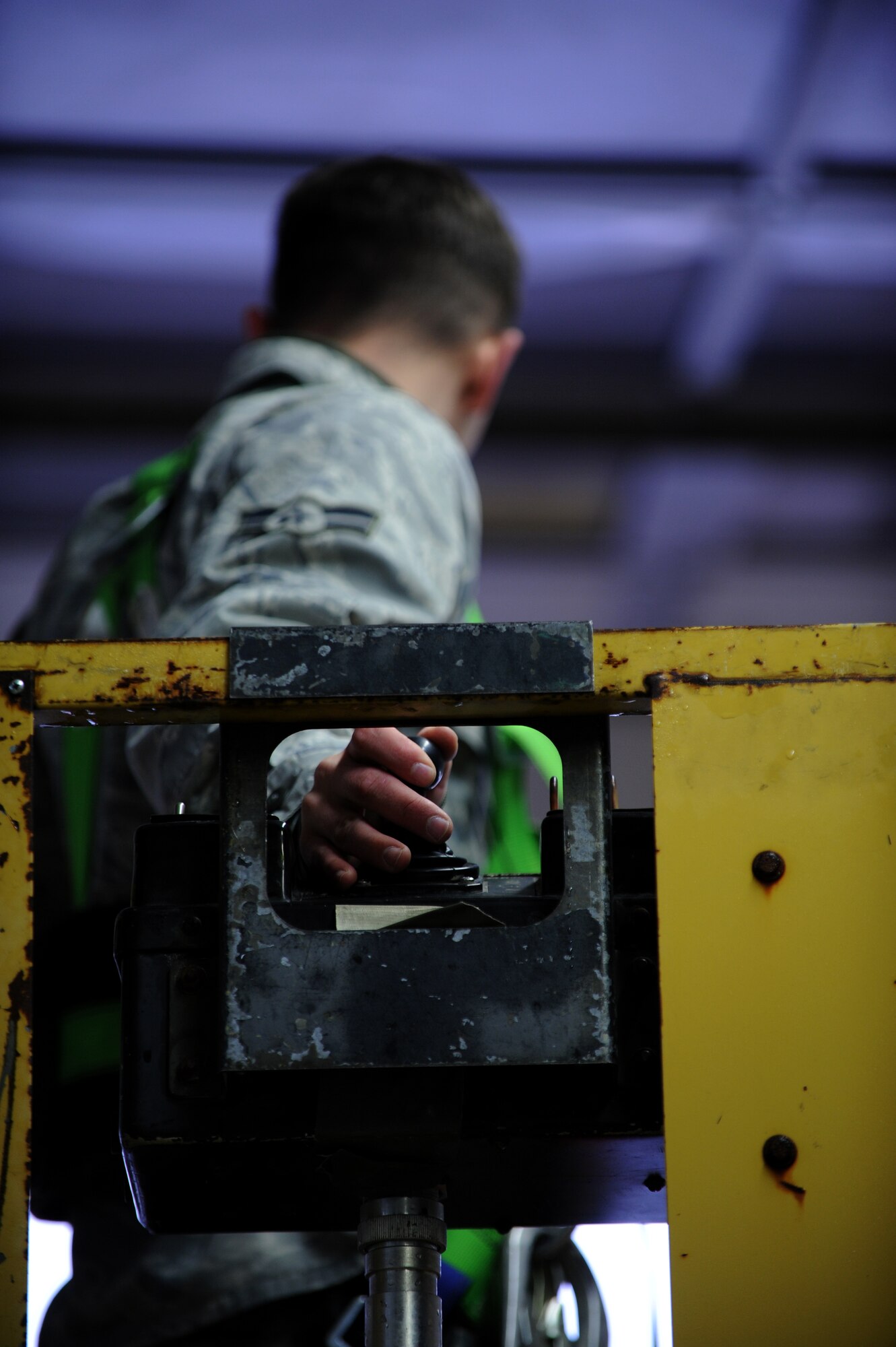 SPANGDAHLEM AIR BASE, Germany – Airman 1st Class Troy Heirling, 52nd Civil Engineer Squadron electrical-systems apprentice, operates a lift after removing a damaged fire detector in bldg 189 here Nov. 28. The alarm shop is responsible for maintaining, replacing and monitoring all security and fire-alarm systems on base. (U.S. Air Force photo/Airman 1st Class Matthew B. Fredericks)
