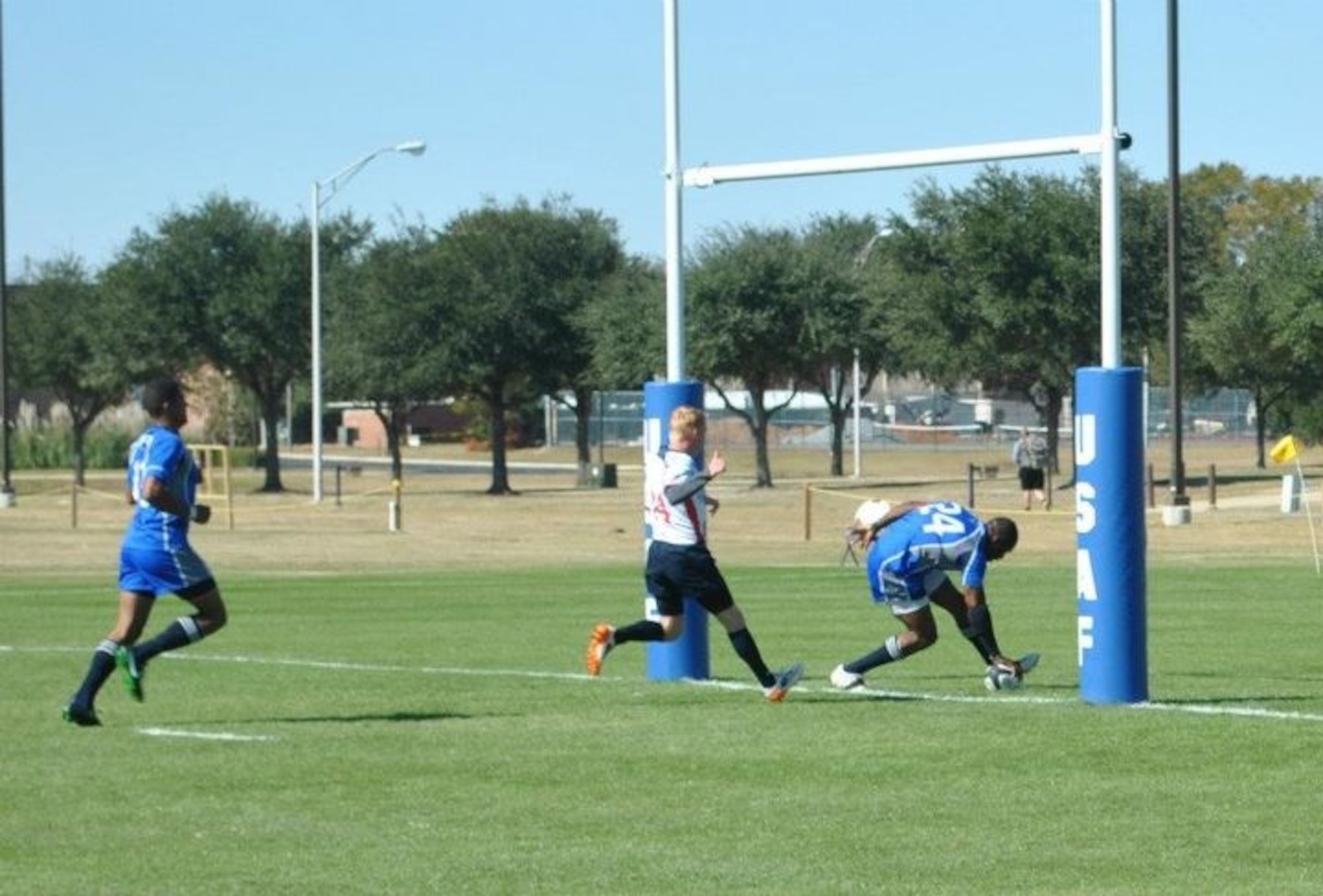 Staff Sgt. Cameron Freeman with the 569th U.S. Forces Police Squadron was selected to be a member of the All-Tournament Rugby Team after scoring four ‘tries’ against the Coast Guard in the Armed Forces Rugby championship, Nov. 5 at Fort Benning, Ga. The Air Force team scored a total of seven tries -- bring the team to win its eight tournament in a row. (Courtesy photo).