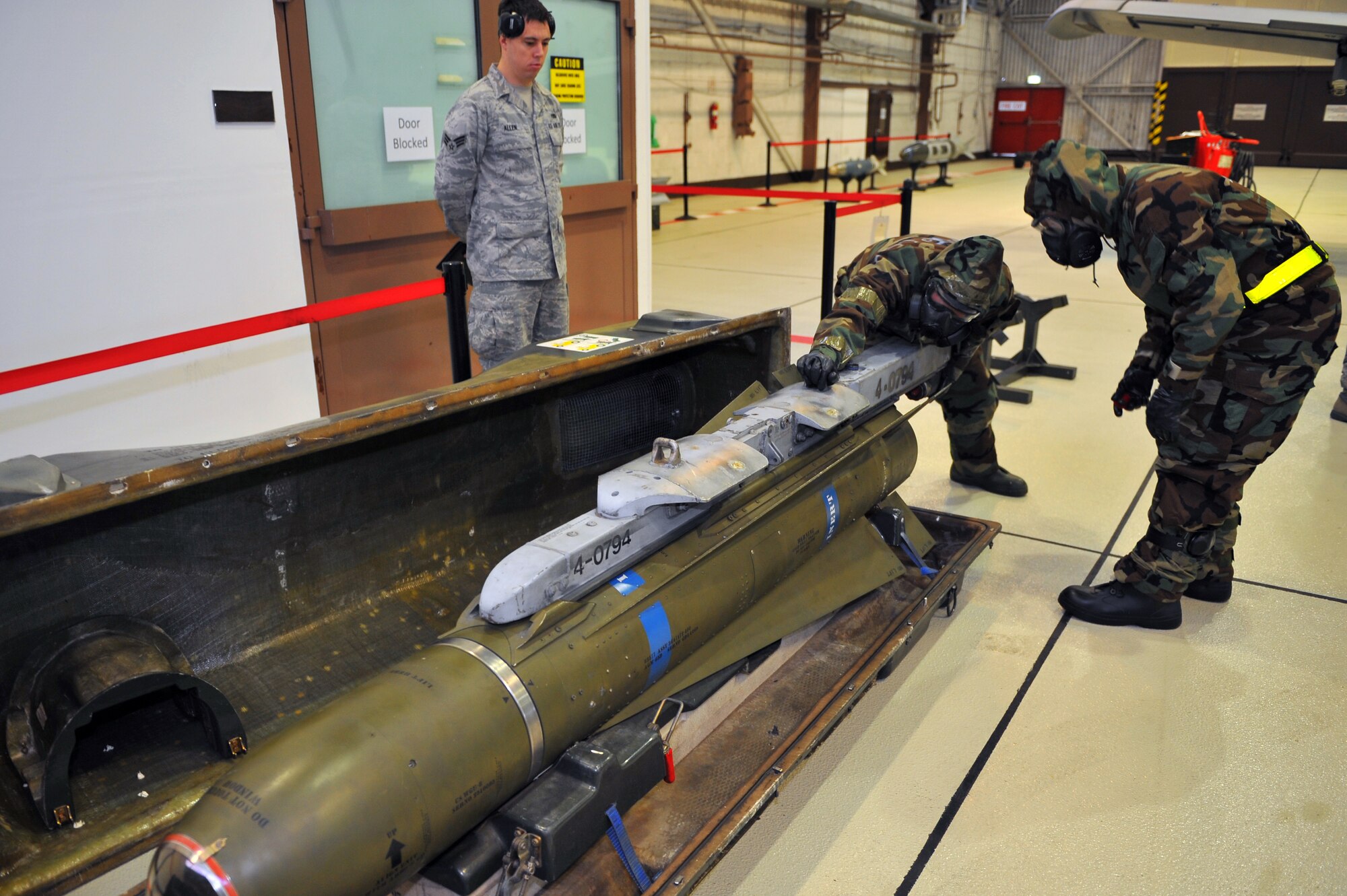 SPANGDAHLEM AIR BASE, Germany – Airmen assigned to the 52nd Aircraft Maintenance Squadron slide a LAU-117 launcher onto an AGM-65 missile before loading the complete assembly on an A-10 Thuderbolt II during a munitions-loading evaluation here Nov. 29. The evaluation ensures load-crew members and team chiefs retain their qualification to load all munitions and are ready for mission taskings. Crew members complete an evaluation every month and are required to be evaluated annually while wearing chemical-warfare gear. (U.S. Air Force photo/Airman 1st Class Dillon Davis)