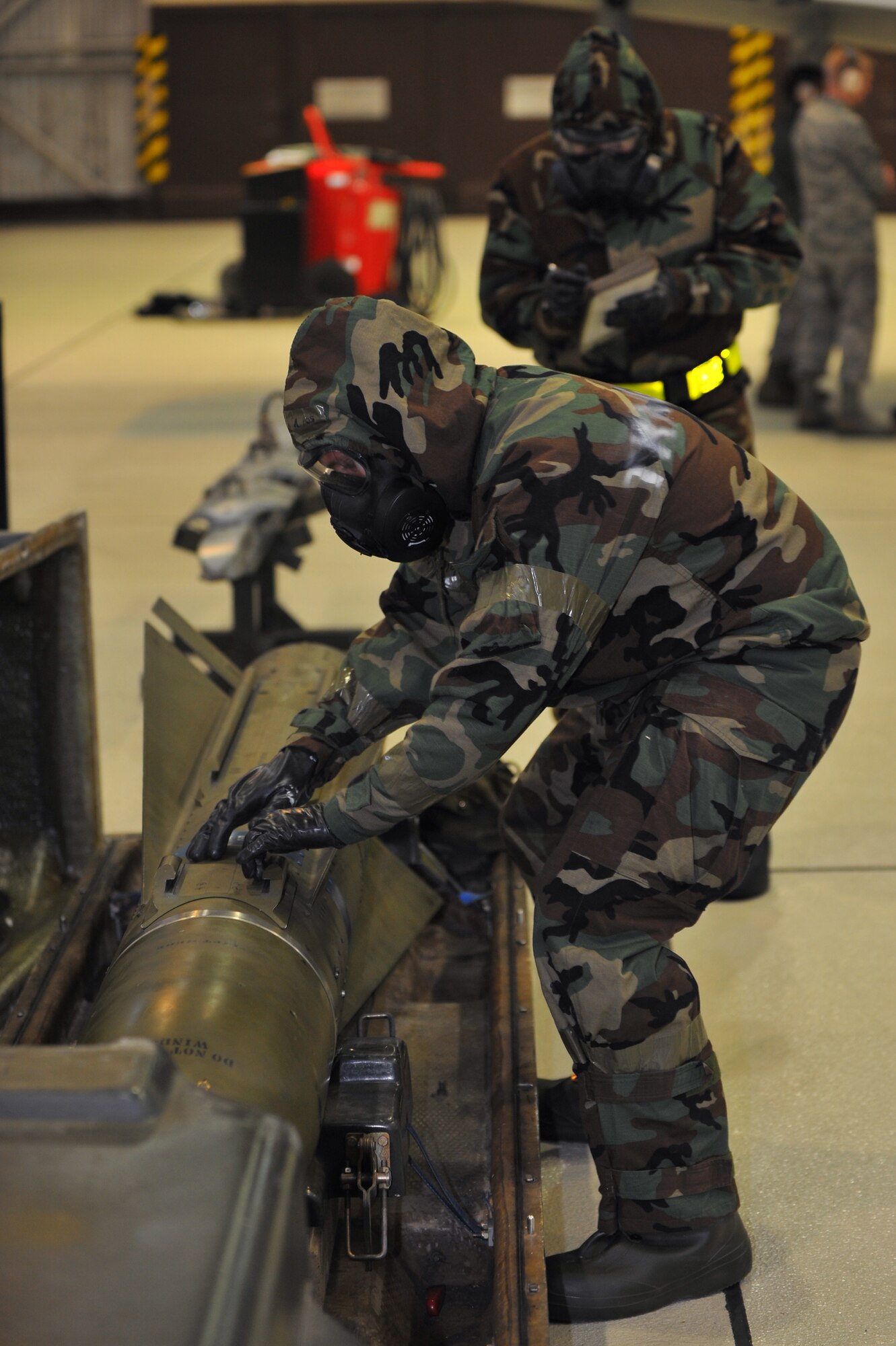 SPANGDAHLEM AIR BASE, Germany –Senior Airman Stephen McCarty, 52nd Aircraft Maintenance Squadron load-crew member, inspects an AGM-65 missile before loading it on an A-10 Thunderbolt II during a munitions-loading evaluation here Nov. 29. The evaluation ensures load-crew members and team chiefs retain their qualification to load all munitions and are ready for mission taskings. Crew members complete an evaluation every month and are required to be evaluated annually while wearing chemical-warfare gear. (U.S. Air Force photo/Airman 1st Class Dillon Davis)