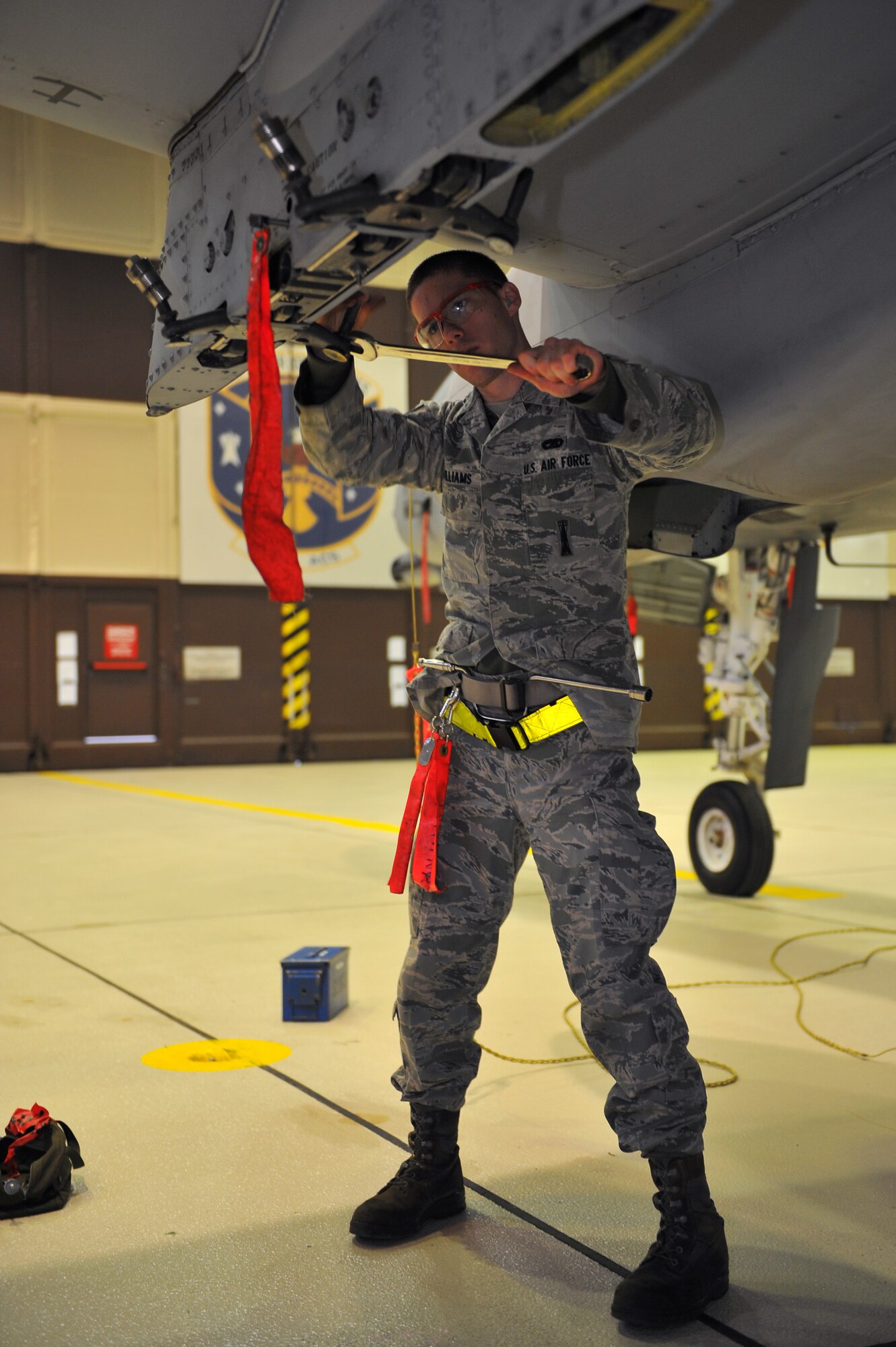 SPANGDAHLEM AIR BASE, Germany – Airman 1st Class Eric Williams, 52nd Aircraft Maintenance Squadron load crew member, prepares an A-10 Thunderbolt II’s MAU-40 bomb rack during a monthly munitions loading evaluation here Nov. 29. The evaluation ensures load-crew members and team chiefs retain their qualification to load all munitions and are ready for mission taskings. Crew members complete an evaluation every month and are required to be evaluated annually while wearing chemical-warfare gear. (U.S. Air Force photo/Airman 1st Class Dillon Davis)