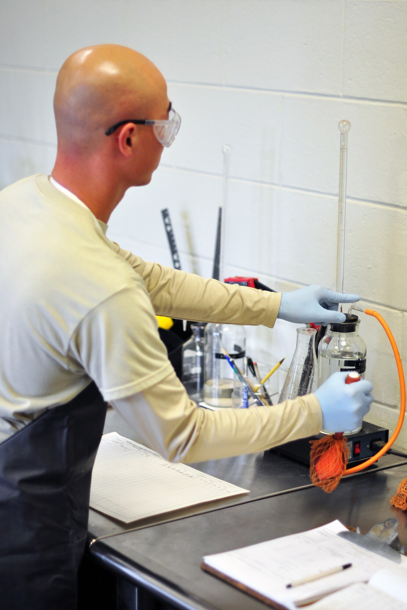Tech. Sgt. Kyung Pak, 51st Civil Engineer Squadron, checks a water sample for alkaline levels Dec. 1, 2011. Recently the base has experienced a change in taste and smell of the base water, which was caused by harmless algae that formed in the Seoul treatment plant due to the change in weather. Base water is still safe to drink but may take a few weeks to get back to normal. (U.S. Air Force photo/Tech. Sgt. Chad Thompson)