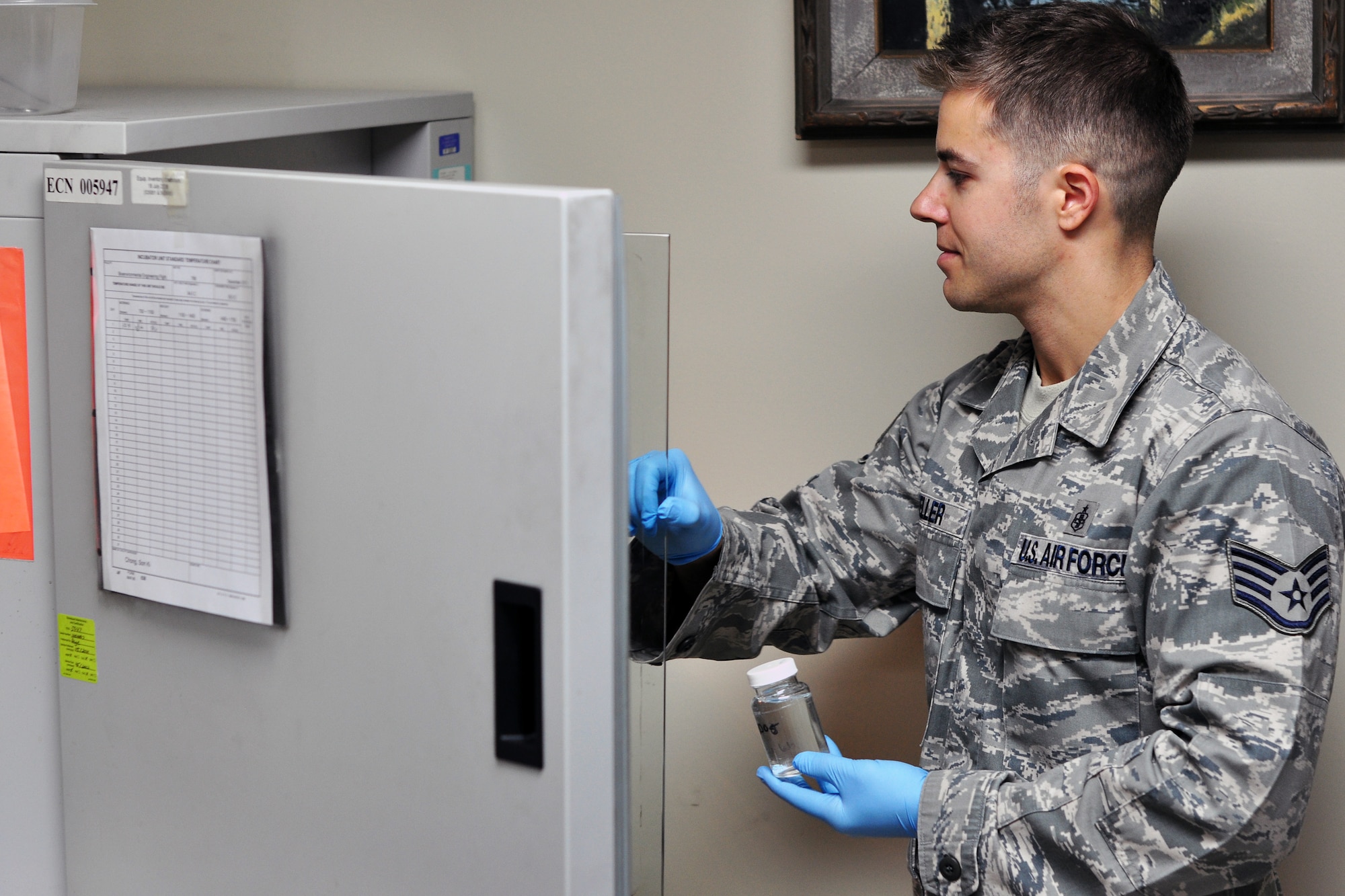 Staff Sgt. Ryan Keller, 51st Aerospace Medicine Squadron Bioenvironmental Flight, places a water sample in an incubator to check for bacteria Dec. 1, 2011. Recently the base has experienced a change in taste and smell of the base water, which was caused by harmless algae that formed in the Seoul treatment plant due to the change in weather. Base water is still safe to drink but may take a few weeks to get back to normal. (U.S. Air Force photo/Tech. Sgt. Chad Thompson)