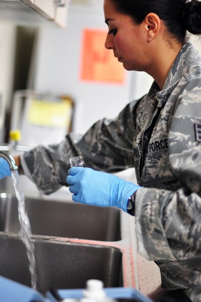 Senior Airman Sara Solis, 51st Aerospace Medicine Squadron Bioenvironmental Flight, uses takes a water sample, at Osan Air Base, Republic of Korea, Dec. 1, 2011. Recently the base has experienced a change in taste and smell of the base water, which was caused by harmless algae that formed in the Seoul treatment plant due to the change in weather. Base water is still safe to drink but may take a few weeks to get back to normal. (U.S. Air Force photo/Tech. Sgt. Chad Thompson/Released)