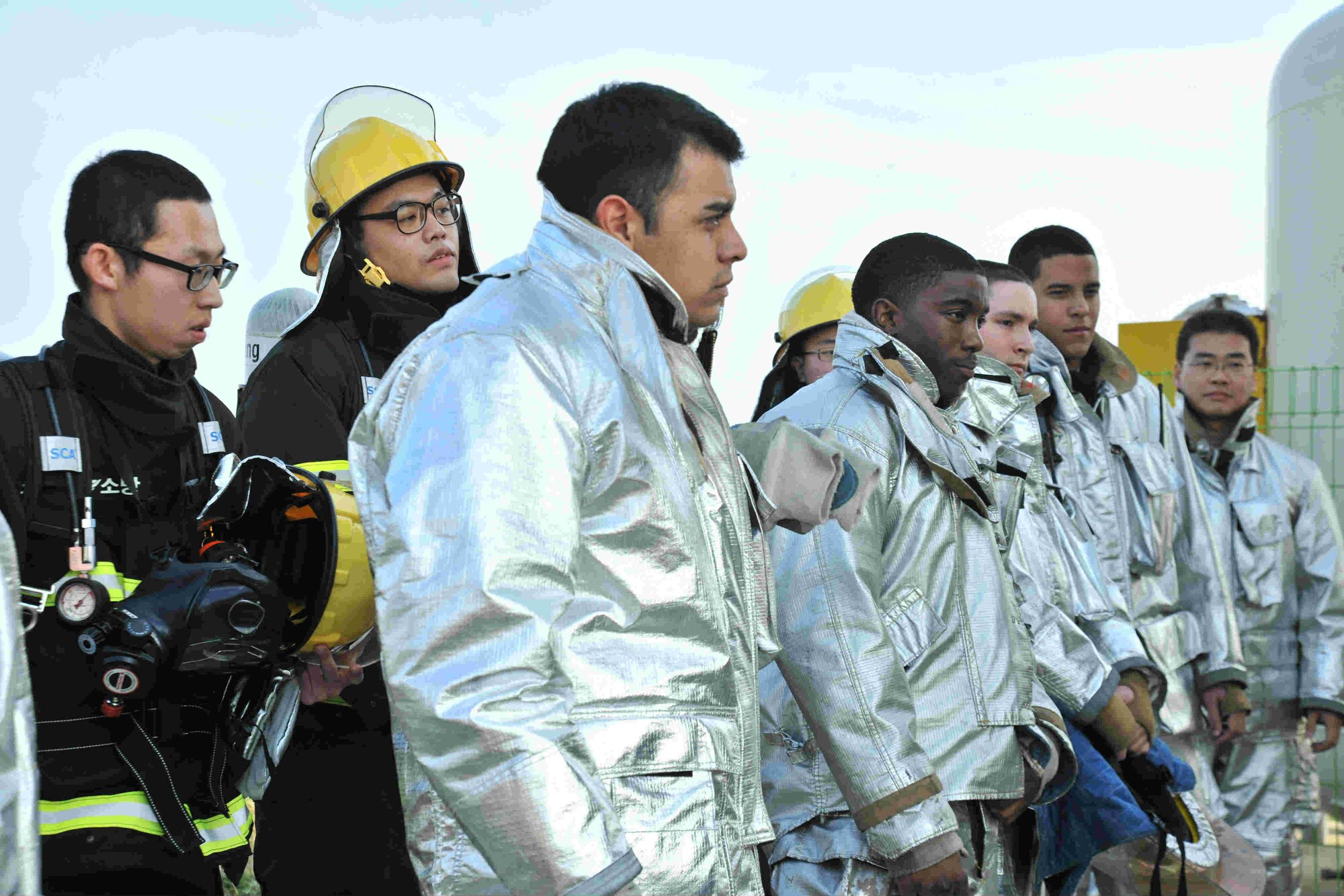 Firefighters from the 8th Civil Engineer Squadron and Republic of Korea Air Force’s 38th Fighter Group firefighters receive a briefing before participating in training at Kunsan Air Base, Republic of Korea, Nov. 28, 2011. Firefighters from the 8th Civil Engineer Squadron trained ROKAF firefighters in search and rescue techniques. (U.S. Air Force photo by Senior Airman Brittany Y. Auld/Released)