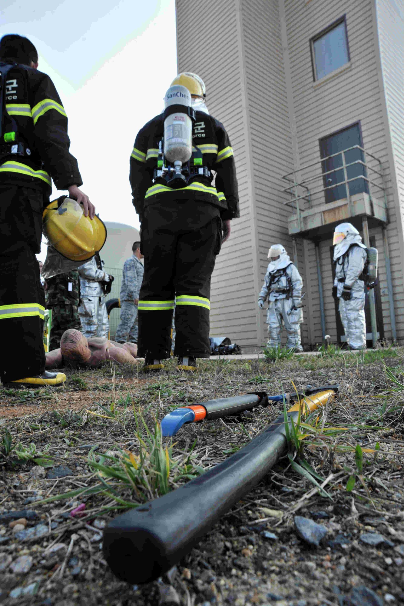 Firefighters from the 8th Civil Engineer Squadron and Republic of Korea Air Force firefighters prepare for training at Kunsan Air Base, Republic of Korea, Nov. 28, 2011. Firefighters from the 8th Civil Engineer Squadron trained firefighters from ROKAF’s 38th Fighter Group in search and rescue techniques. (U.S. Air Force photo by Senior Airman Brittany Y. Auld/Released)