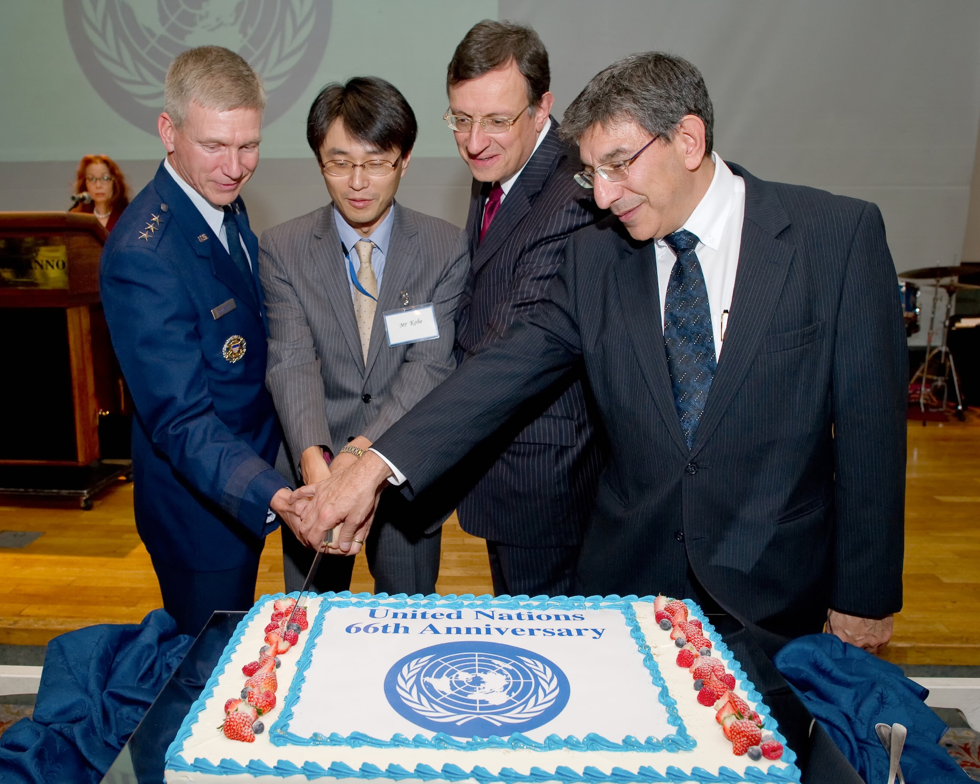 TOKYO, Japan -- (from left to right) Lt. Gen. Jeffrey Remington, United Nations Command, Korea, deputy commander, Yasuhiro Kobe, Ministry of Foreign Affairs North American Affairs bureau, Ambassador David Warren, U.K. Embassy, Japan, and Ambassador Jonathan Fried, Canadian Embassy, Japan, cut the ceremonial cake to commemorate the United Nations Command 66th Annual Reception, Nov. 29, 2011 at New Sanno Hotel. (U.S. Air Force photo/Osakabe Yasuo)