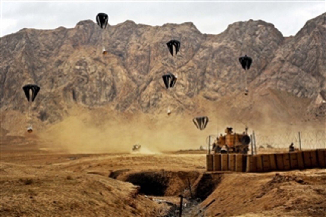 Aircrews drop supplies over the village of Shah Joy, Afghanistan, on Nov. 26, 2011.  The supplies sustain forward operating bases, combat outposts and service members living at those locations.  