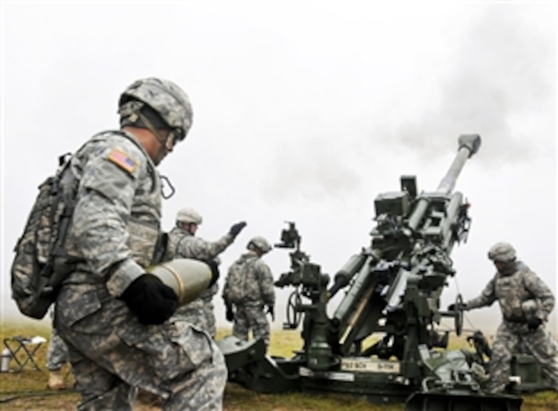 U.S. soldiers from launch a round downrange during a live-fire exercise on Grafenwoehr Training Area, Germany, Nov. 30, 2011. The soldiers are assigned to Bravo Battery, Fires Squadron, 2nd Cavalry Regiment.