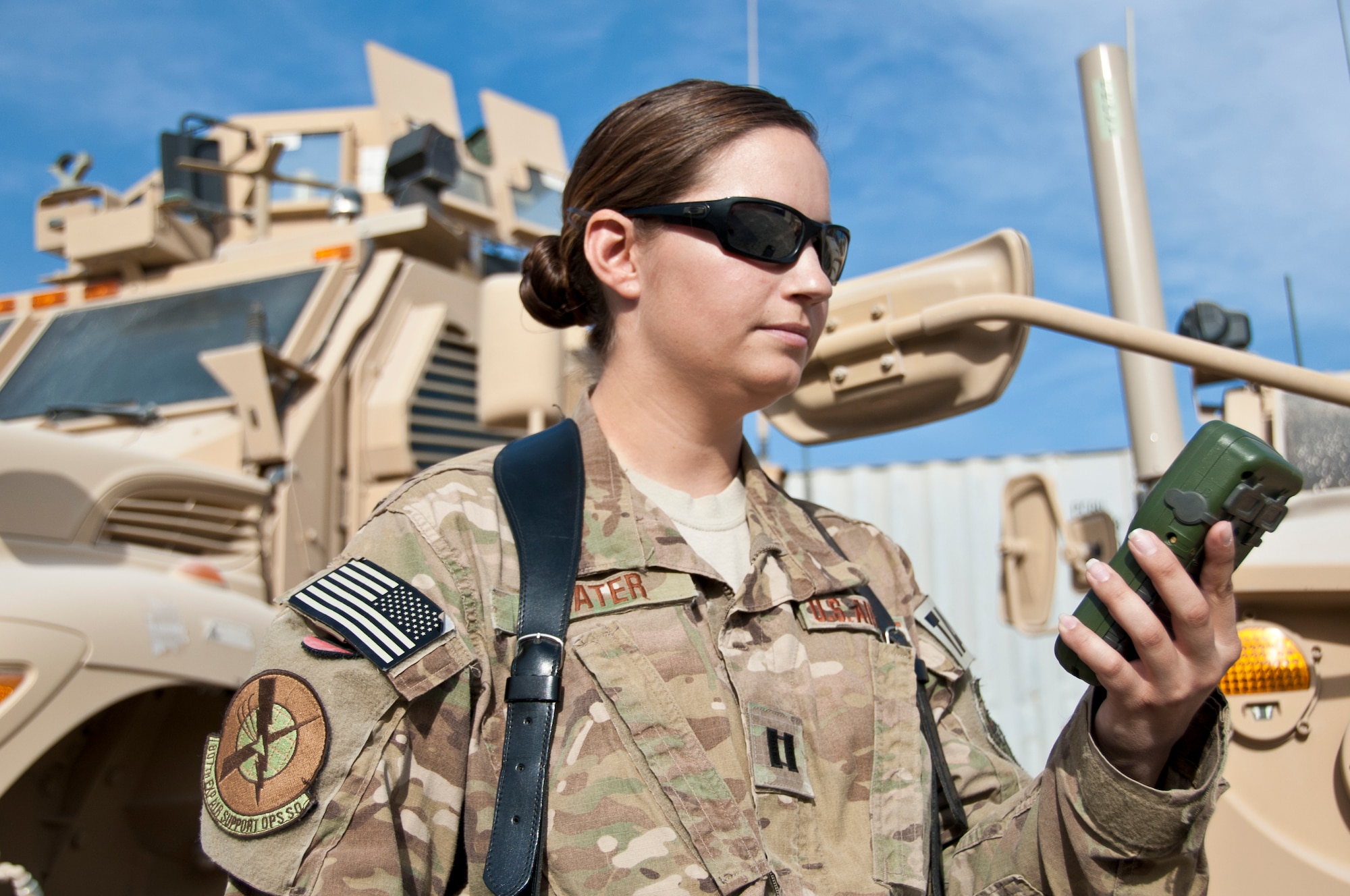 KANDAHAR AIRFIELD, Afghanistan -- Air Force Capt. Bryony Veater, Space Liaison Officer and Space Weapons Officer embedded with the 807th Expeditionary Air Support Operations Squadron, looks at a Defense Advanced GPS Receiver Nov. 23, 2011. Over the past six months, Veater has been training U.S. and coalition forces how to best utilize space into ground warfare. (U.S. Air Force photo by Staff Sgt. David Carbajal)