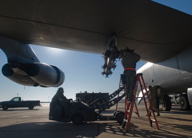 Barksdale Airmen from the 2nd Maintenance Operations Squadron load a M117 bomb onto a B-52H Stratofortress on Barksdale Air Force Base, La., Nov. 30. Weapon loaders are tested monthly on proficiency and accuracy to ensure mission readiness. (U.S. Air Force photo/ Senior Airman Kristin High)(RELEASED) 