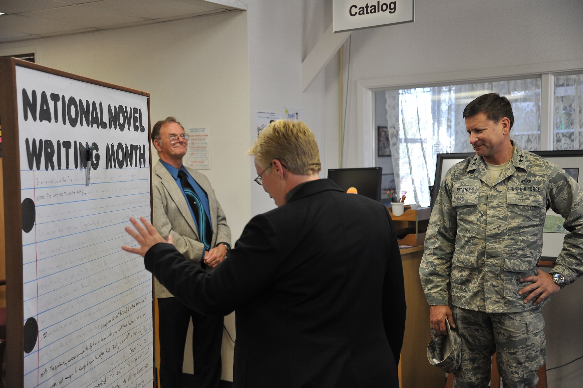 GOODFELLOW AIR FORCE BASE, Texas -- Maj. Gen. Leonard Patrick, 2nd Air Force Commander, is shown a short novel written by multiple Team Goodfellow students at the base library here Nov. 30. This is one of the multiple places he stopped by during his three-day tour of Goodfellow Nov. 30-Dec. 2. (U.S Air Force photo/Airman 1st Class Michael Smith)