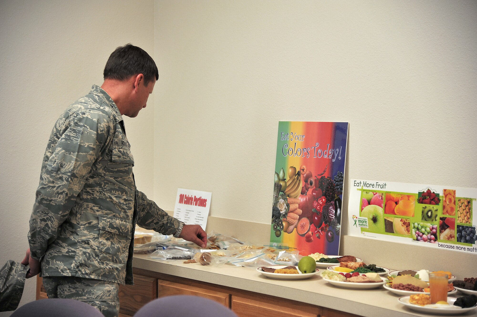 GOODFELLOW AIR FORCE BASE, Texas -- Maj. Gen. Leonard Patrick, 2nd Air Force Commander, looks over food portioned into 100 calories while visiting the Health and Wellness Center here Nov. 30. This is one of the multiple places he stopped by during his three-day tour of Goodfellow Nov. 30-Dec. 2. (U.S Air Force photo/Airman 1st Class Michael Smith)