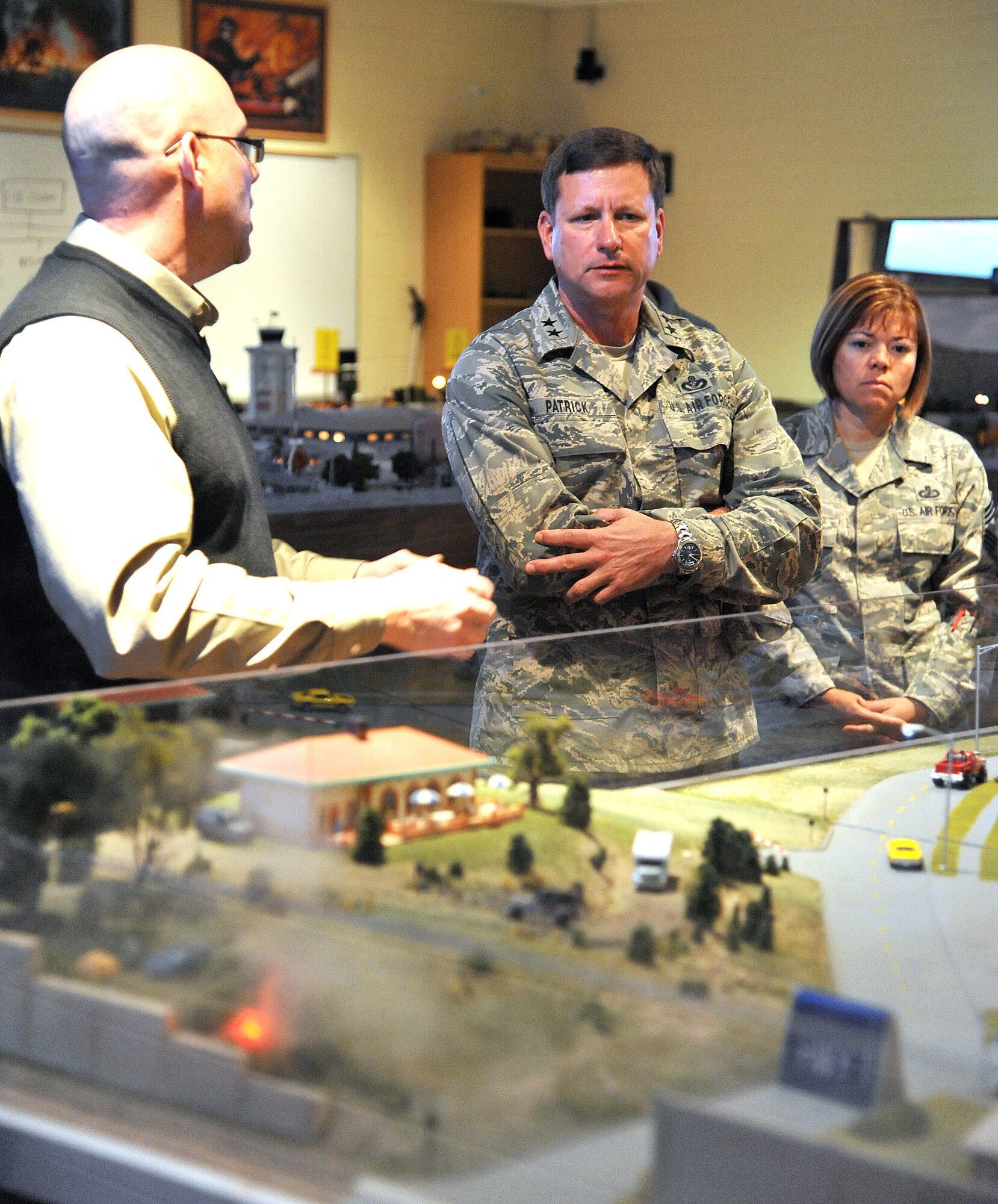 GOODFELLOW AIR FORCE BASE, Texas -- Maj. Gen. Leonard Patrick, 2nd Air Force Commander, and Chief Master Sgt. Angelica Johnson, 2nd Air Force Command Chief, are given a demonstration of the Norma Brown Trainer at Louis F. Garland Fire Academy here Dec. 1. The trainer is used to give students a visual reference when it comes to base and city wide incidents. The general and command chief spent three days touring various facilities around Goodfellow Nov. 30-Dec. 2. (U.S Air Force photo/Airman 1st Class Michael Smith)