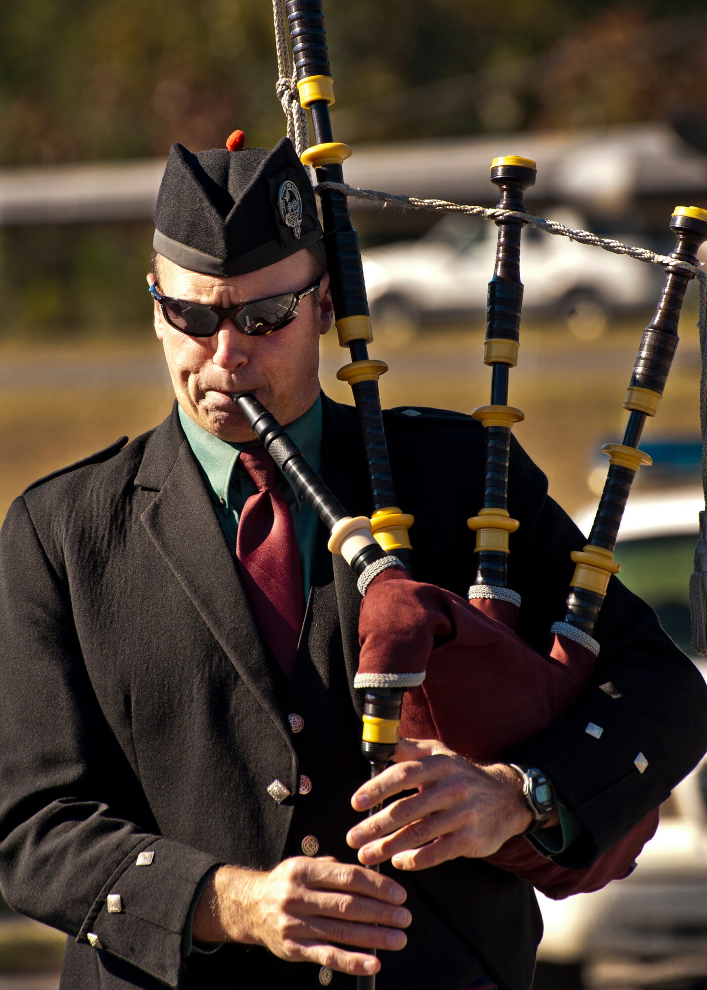 Master Sgt. Steven Bicknell, of the 919th Maintenance Squadron, plays ‘Amazing Grace’ on the bagpipes during the military working dog memorial ceremony held for IQ, one of Eglin’s K-9s, at the Air Force Armament Museum, Dec. 1.  IQ died unexpectedly Nov. 6 of bloat, a stomach condition.  He joined the Air Force in March 2010 and came to Eglin in Nov.  2010.  IQ was fully trained and qualified by his partner, Staff Sgt. Brandon Hardy, of the 96th Security Forces Squadron, in May.  At the memorial, Hardy said IQ’s name fit him perfectly and he served his country well.  (U.S. Air Force photo/Samuel King Jr.)