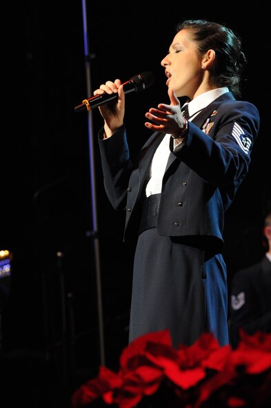 Tech. Sgt. Emily Lewis, U.S. Air Force Band Singing Sergeant, performs “All I want for Christmas” Dec. 2 at the Daughters of the American Revolution Constitution Hall, Washington, D.C. This year’s free 2011 Holiday Concert Series theme is “Celebrate me home,” honoring servicemembers returning from deployments. (U.S. Air Force photo by Staff Sgt. Christopher Ruano)