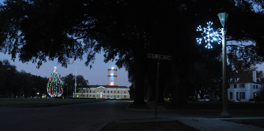 Holiday lights flicker after the countdown during the holiday tree lighting ceremony on Barksdale Air Force, La., Dec. 1. The event started with the Barksdale Youth Center Choir singing holiday songs, followed by the illumination countdown and a visit from Santa Claus.  (U.S. Air Force photo/Airman 1st Class Micaiah Anthony)(RELEASED)