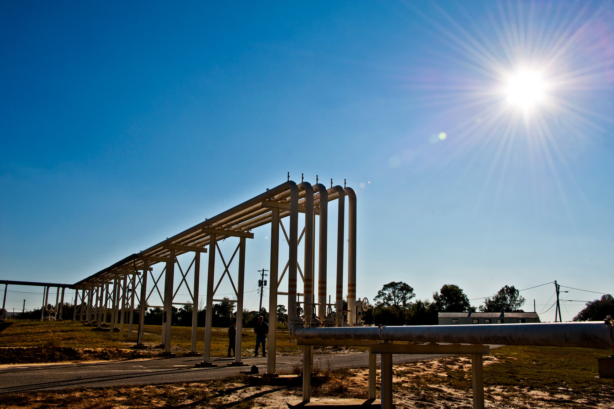 A pipeline makes its way from Weekly Bayou to one of three bulk storage tanks located on Eglin Air Force Base, Fla.  Air Force jet fuel can be delivered by barge or by tanker truck to the base.  (U.S. Air Force photo/Samuel King Jr.)